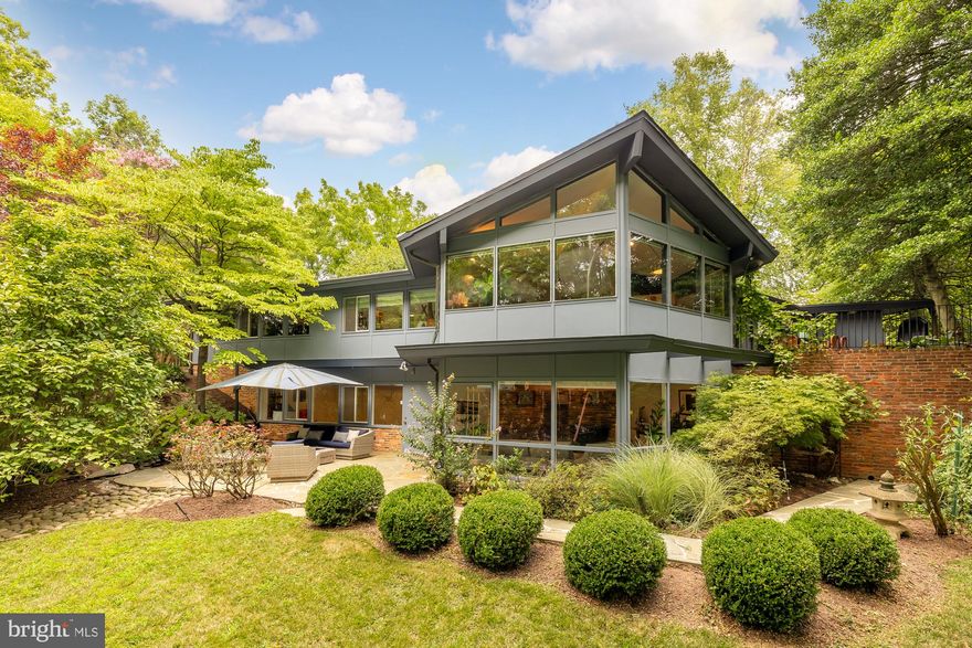 Serenity and elegance await you at this stunning mid-century contemporary home from renowned DC architecture firm Deigert & Yerkes, nestled in the sought-after Rock Creek Hills neighborhood of Kensington. Bathed in natural light, this architectural gem offers over 3,000 square feet of living space on a peaceful one-third acre lot, situated at the end of a tranquil cul-de-sac. This home boasts exquisite details, including soaring cathedral and vaulted ceilings, exposed brick walls, and wide-plank pegged hardwood floors. The heart of the home is the open living, dining, and kitchen area, centered around a dual-sided gas fireplace. Expansive windows in the living and dining rooms offer sweeping views and provide access to a beautiful stone terrace, perfect for al fresco dining. The well-appointed kitchen, discreetly positioned behind the dining area, features central cabinetry that elegantly separates the spaces. Adjacent to the main foyer, you'll find a sleeping wing that includes a luxurious primary suite. This retreat features an updated en suite bath, private terrace access, and steps leading to the back patio and expansive yard. Two additional bedrooms with built-in storage and a newly renovated hall bath with a tub complete this area, providing comfort and convenience for family and guests. The lower level, accessible via stairs from the main foyer, mirrors the light-filled ambiance of the upper floor. This walk-out level includes a versatile fourth bedroom or office, complete with its own fireplace, an updated full bath with tub, and a bright recreation room—all featuring new luxury vinyl flooring. The level also offers a separate laundry room with a convenient laundry chute from both upstairs bathrooms, a large cedar-lined storage room, and an additional unfinished storage space currently used as a gym.

The professionally landscaped and hardscaped grounds further enhance this home's appeal. The backyard is fully enclosed with both a wood fence and an invisible fence, providing privacy and security, and includes thoughtfully placed landscape lighting. Numerous updates throughout the home, including  a full-house generator, security system, and recessed lighting blend modern amenities with timeless design, creating your perfect sanctuary. Ideally located a stone’s throw from the scenic trails of Rock Creek Park and a mile from the quaint town of Kensington, you'll enjoy easy access to charming shops, parks, restaurants, children’s library and the weekend farmer's market. Commuting to nearby downtown DC is a breeze with convenient access to surrounding areas, including via the MARC train and metro.