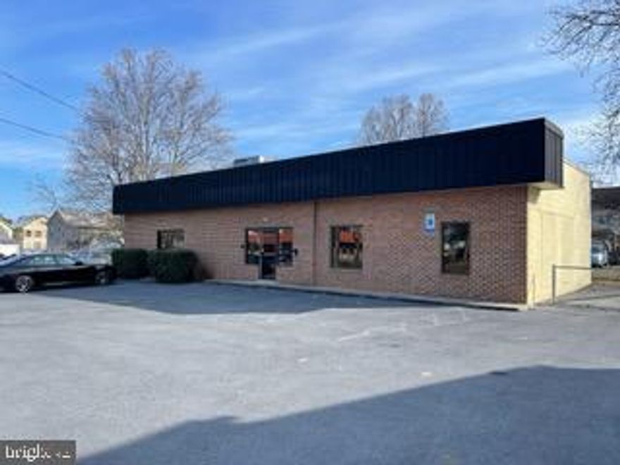 Prime commercial opportunity on Route 11 with excellent visibility and steady traffic flow. This well-maintained brick building offers approximately 2,500 sq. ft. of flexible mixed-use space suitable for professional services, retail, medical, salon/spa, fitness, daycare, or general office use. The interior provides an open, adaptable layout with level entry access, public utilities, electric heat, and central A/C. Outside, the 0.32-acre corner lot includes a paved parking lot with six dedicated spaces. Whether you're expanding, relocating, or launching a new business, this property offers the accessibility and visibility to support long-term success.