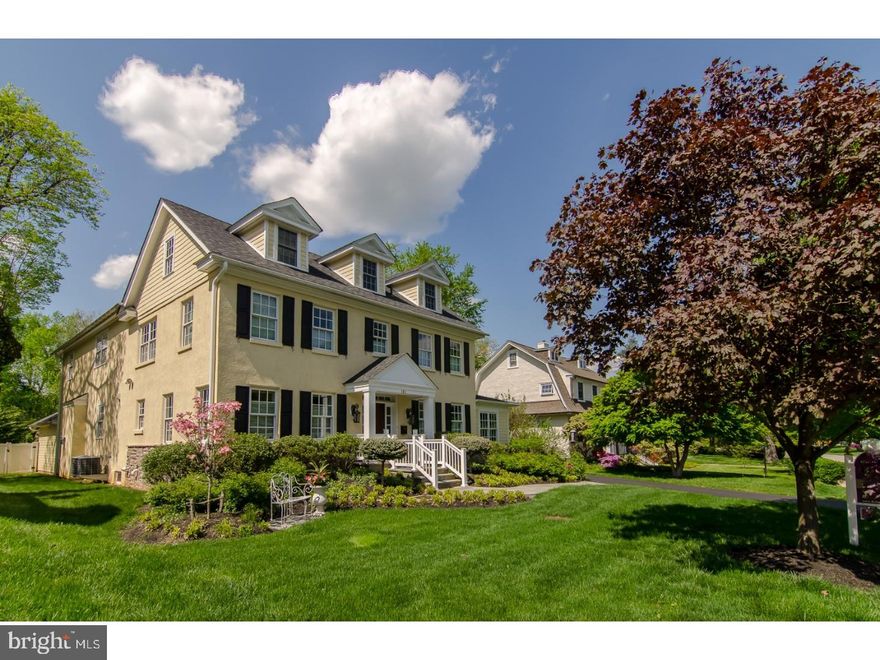 Own a piece of history at a prime address that's walkable to Wayne & convenient to it all! This historically-registered Colonial is like a new house on the inside within the distinctive original restored facade. Experience the old world charm you dream of complemented by the modern amenities you desire thanks to a full & impeccable renovation, completed in 2011. The many enhancements of this rare offering include an addition, new electric, plumbing & flooring plus redone kitchen & baths. The award-winning professionally-landscaped yard is fenced in the rear, with a trellis-covered paver-stone patio for outdoor parties & heated saltwater pool installed in 2012. Another unique feature is the home's energy efficiency, with the distinction of being Green Building-Emerald Level Certified.   Boasting curb appeal galore & a stately, welcoming presence, a flagstone walkway brings you to the inviting covered entry. Beyond the elegant front door is a gracious Center Hall with a coat closet, classic millwork & site-finished oak floors that cover all main rooms. Open archways present formal living & dining rooms affording an ideal backdrop for entertaining. High-end designer lighting adds sophistication. The airy living room with front & rear exposures is centered by a gas fireplace that's encased in ceiling-high paneling & flanked by French doors to the sunny study. Beauty envelopes you in the dining room as well which connects to the kitchen through a hallway with a command center featuring a built-in desk & granite countertop. The modern kitchen is equipped with stainless steel appliances, furniture-style cabinetry, granite countertops, a large center island with seating & a walk-in pantry. Side glass doors lead you out to the driveway & side yard. The adjacent open-plan family room graced by a stone gas fireplace keeps everyone comfortable & connected while you're cooking. A laundry/mudroom with built-in cabinetry & a closet provides inside access to the attached 2-car garage. Up the graceful main staircase adorned with decorative applied & chair rail moldings awaits an open landing. Double doors introduce the vaulted master suite occupying the rear wing, with his & her fitted walk-in closets & a spa-like bath. Three additional bedrooms offer large fitted closets. The 3rd floor present a den and bonus room with kitchenette adding to the allure of this special gem.