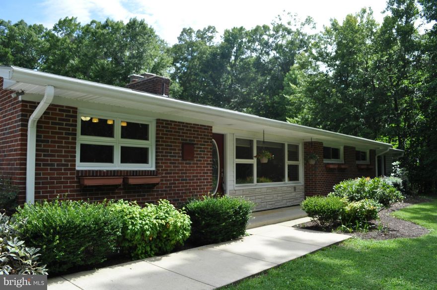 Great retreat - peace & serenity, yet close-in for easy commute! Need a man cave? Huge 40x30 detached garage w/12  ceilings. Possible income producing apt in basement w/sep entrance. LaPlata location   but no town taxes! Gleaming hardwoods, upgraded kitch w/stainless appliances & granite, new carpet/paint, ceramic baths, big master suite w/spa-like bath. Salt-water pool, deck, built in BBQ & more!