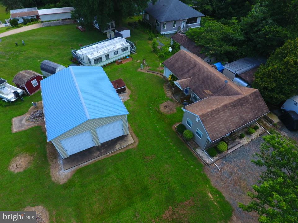 Lovely renovated ranch-style home offering 2 bedrooms and 1 full bath, situated on a nice lot. This sale consists of three lots (39, 40 & 41 in Glen 8) with plenty of outdoor space in Indian Acres at the Chesapeake Campground. The primary bedroom features wall-to-wall carpet, a ceiling fan, and lots of windows, plus an adjacent sitting room perfect for a sitting room or extra space for bunk beds. The large kitchen has ample cabinets and a dining area with stainless steel appliances. The property includes central heat and air, an attached garage with an electric opener, and a large detached garage with two overhead doors and a sliding side door — ideal for extra storage, boat storage, a workshop, or hobby space. This vibrant gated campground community offers amazing amenities including a boat ramp to the Sassafras/Chesapeake Bay, pools, a convenience store, baseball field, fishing, boating, an arcade, and plenty of activities for all ages. Golf cart friendly and open year-round, with use limited to 150 days per year (no more than 100 consecutive). Discover the charm of Indian Acres and seize this unique, priced-to-sell opportunity today!