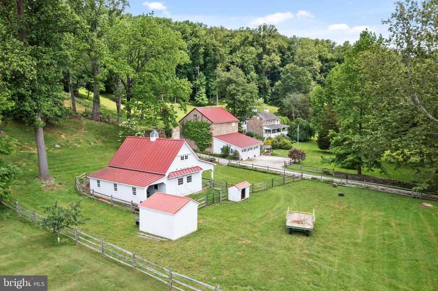 Located on a quiet country road in the desirable Chester Springs and within walking distance to the Village of Birchrunville. Hard Scrabble Farm is surrounded by 250 acres of conserved land with breathtaking views of stone walls and the countryside. The Circa 1821 Stone Farmhouse has a wrap around porch and is surrounded by stone walkways and gardens with extensive landscaping.  The farmhouse entrance leads to  a formal living room and dining room. The gourmet kitchen has a breakfast area and a family room all with access to the wrap around porch. The primary bedroom suite has its own wing with access to a private balcony. A large historic bank barn has an attached 3 car garage with a large loft with attached office. Perfect for a party barn! For the equine enthusiast there is an additional Amish built 2 stall barn with side equipment storage and paddocks. Could easily be converted to 4 stalls. Stunning pool with a stone surround and scenic views of the woodlands and countryside. An Amish built log cabin pool house with electric, wet bar and outside shower complete the pool area! Enjoy your own private retreat.! This property has a French and Pickering Creek Conservation Easement and is in Act 319. Close proximity to major routes, shopping and restaurants.