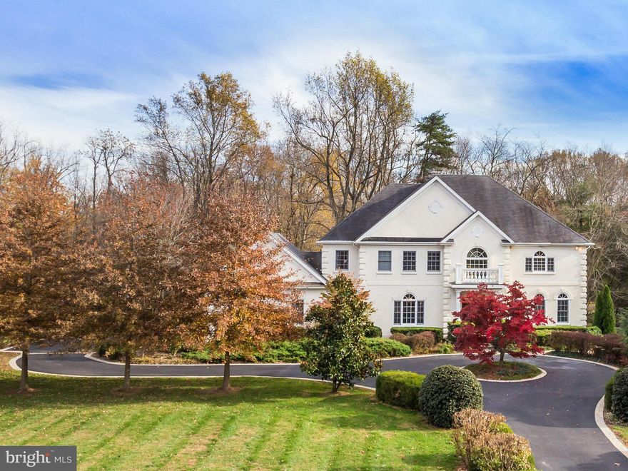 Simply Stunning! Circular drive welcomes you to Georgian estate w/3 awe-inspiring, sun-drenched levels. Impressive 2-story foyer w/dramatic staircase & open/airy layout. Floor-to-ceiling palladian windows/ 360  wooded views! 6000+ sf extraordinary living extends outdoors to 2 screen porches overlooking 2+ac of lush privacy! LL for in-laws w/kitchen, laundry, MBR suite & add'l BR & BA. ENERGY EFF!