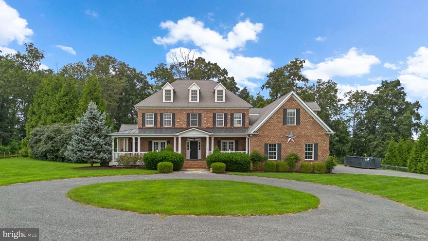*Assumable VA Loan 2.25%.* Welcome to 970 Oak Tree Rd featuring a stunning pool and amazing property with scenic views. From the moment you step inside the welcoming foyer, you’ll appreciate the elegant engineered wood flooring and classic oak balusters. The formal dining room impresses with French doors, double crown molding, chair rail, and warm wood floors, while the library/office provides a quiet retreat with wall-to-wall carpeting overlooking the front porch. Gourmet kitchen featuring walk-in pantry, breakfast bar with built-in cabinetry, wall oven, microwave, five-burner gas range, French door refrigerator, and dishwasher. Bright morning room with a wall of windows and built-in bench overlooks the rear yard. Sunken family room with shadowbox molding, trayed ceiling with crown molding, and gas fireplace with a stone mantle and hearth. Additional main-level spaces include a convenient powder room, a butler’s pantry with sink, and a distinctive bar room showcasing cathedral ceilings, wood-paneled walls, and built-in shelves. Upstairs, the spacious master suite is a relaxing retreat complete with a walk-in closet and a luxurious master bath featuring a walk-in shower, jetted tub, and linen closet. Bedrooms two and three are connected by a Jack and Jill bathroom, while bedroom four, and bedroom five with an adjoining playroom provide ample space. A full hall bath (third on upper level) and a convenient laundry room with sink and countertops complete the upper level, which is easily accessible by two separate staircases. The lower level features impressive nine-foot ceilings and multiple spaces designed to fit your lifestyle. Recreation room is huge and bright. The home theater is equipped with built-in speakers, a projector and screen, and plush wall-to-wall carpeting for a true cinematic experience. A full bathroom with ceramic tile flooring and a stand-up shower adds convenience, and a walk-up staircase offers easy access to the backyard and pool. Numerous modern systems: tankless water heater and sump pump installed in 2021, a radon mitigation system, geothermal heating, and water neutralizer and softener. Outside, you’ll find a beautiful combination of brick and beaded vinyl siding, a circle driveway, and an oversized three-car garage. The front porch with composite decking overlooks a scenic vista/rural view. Flagstone sidewalk. Rear composite deck is perfect for entertaining. The fenced yard includes a private pool with diving board, a hot tub, and a poolside shed equipped with a refrigerator and sink. The property is served by a septic system with a sand mound. This exceptional home combines luxury, functionality, and timeless design—offering everything you need for comfortable living and memorable entertaining.