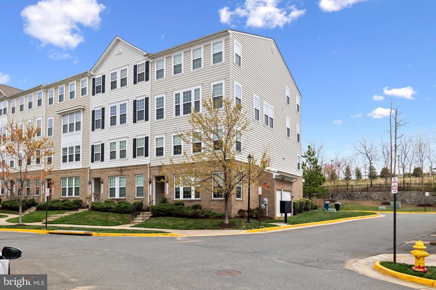 Enjoy this beautiful 2 level condo!  End unit for great natural light with private views from rear!  Visitor parking conveniently in front of home!  Beautiful hardwood floors on main and upper levels  Open and contemporary  Large prep island in kitchen  Granite counters & stainless steel appliances  Upgraded lighting with gorgeous pendant lights above island    One car garage     Upper level includes 3 bedrooms and 2 full baths plus laundry    Primary bedroom has 2 large walk-in closets   Custom blinds   Primary bath features huge vanity plus large shower   Bedroom #3 has private balcony   Immaculate and Ready!