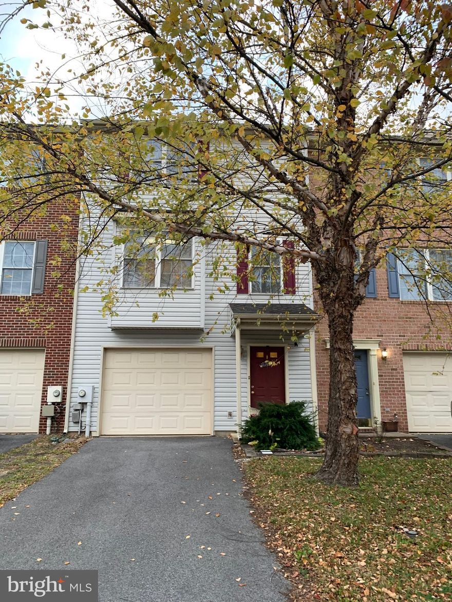 This Spacious Townhouse has been gently lived in and offers it's  new owner some Beautiful Hardwood Floors  throughout.  The lower level will welcome you and your guest home through the foyers main entrance or your 1-car attached garage.  The lower  level has a spacious room that could be used as a 4th Bedroom, Craft Room, Office, Playroom,   The Laundry Room/utility is also located there.   The Beautiful Wood Staircase leads up to the middle floor where you find the living room/dining room combo, gorgeous hardwood flooring, kitchen, center island bar and the powder room half bathroom.    There is a 8 x 16 Rear Deck located off the living room.   The Upper level offers the owners suite with a walk in closet , tray/vaulted ceiling, ceiling fan, beautiful hardwood flooring throughout and full bath.   There is 2 other spacious bedrooms one of them offers a walk-in closet and more hardwood flooring, a full bathroom and linen closet.  All Blinds Convey, curtains and mounting brackets.    The TV in the owners suite stays.   Custom Built Shelves convey, all appliances stay.   The HVAC was replaced in June of 2022 and a new air handler.  There is a brick patio and fenced-in backyard.   This 3-Level townhouse boast over 1726 sq feet of living space.   Located in Hammonds Mill.  Easy Access to I-81, shopping and schools.    Motivated Seller bring any and all reasonable offers.  Easy to Show.  Call Today.