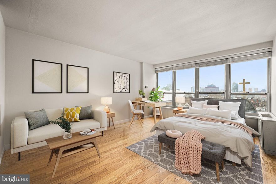 Welcome to this renovated studio at The Dorchester on Rittenhouse Square, offering comfort, style, and full-service living in one of the city’s most desirable buildings. This light-filled residence features rich hardwood floors, granite countertops, stainless steel appliances, and a clean, well appointed bathroom.
The thoughtfully designed open layout maximizes space and functionality, while oversized windows fill the space with abundant natural light, creating a bright and inviting atmosphere.  Residents of The Dorchester enjoy premier amenities including a rooftop pool with stunning skyline views, a fully equipped fitness center, 24/7 doorperson service, and laundry facilities conveniently located on the lower level. Valet parking is available for $390/mo.  (vehicle size restrictions apply). The monthly condo fee includes all utilities, adding exceptional value and convenience. Cable and Internet are $61 per month. Ideal as a chic city residence, pied-à-terre, or investment opportunity, this move-in ready studio combines modern finishes with exceptional building amenities in an unbeatable Rittenhouse Square location.