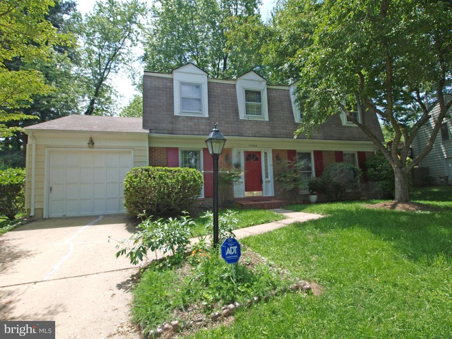 Classic colonial on quiet cul-de-sac on edge of Wheaton Regional Park: Hardwood floors thruout; family room off kitchen  with brick fireplace and sliding door to large level backyard;updated baths: updated kitchen with new appliances and porcelain tile floor;oversized laundry room off kitchen and garage;abundance of closet space and storage; near Glenmont Metro, shopping and Brookside Gardens