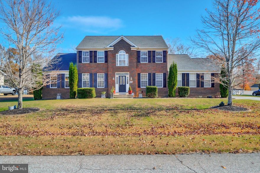 Elegant Brick Front Colonial on Nearly One Acre Backing to Woods
Welcome to this beautiful 4/5-bedroom, 3.5-bath brick front colonial set on .95 private acres that back to woods. Boasting over 4,800 square feet of beautifully finished living space, this residence blends classic craftsmanship and modern comfort, all with no HOA.
A grand two-story foyer sets the tone, leading to a thoughtfully designed main level adorned with gleaming hardwood floors and custom tile work crafted by a master artisan. The formal dining room offers an inviting space for entertaining, while the office—complete with built-in bookshelves—creates the perfect setting for work or study.
The heart of the home is the beautiful eat-in kitchen, featuring granite countertops, a peninsula breakfast bar, and a sun-filled breakfast room with access to the deck (2022) overlooking a level yard which backs to trees, perfect for a future pool. Adjacent is the spacious family room with a 18foot ceilings and gas fireplace, ideal for relaxed gatherings and cozy evenings.
The main level primary suite offers a vaulted ceiling, a large walk-in closet, and ensuite bath with a double vanity, garden soaking tub and water closet. A laundry room, half bath, and an oversized 20x20 two-car garage complete the main level.
Upstairs, a catwalk overlooking the family room connects three spacious bedrooms and a full bath, creating a bright and open flow.
The fully finished lower level extends the home’s living space with a bedroom featuring a walk-in closet, two versatile bonus rooms, a full bath, and a large open recreation area—perfect for a home theater, gym, or game room. Extra-wide walk-up stairs lead directly to the backyard.
Additional features include an automatic front-yard rain irrigation system, updated roof and water heater (2023), updated well pump (2022) and new HVAC (12/25).
Nestled on a nearly one-acre lot with no HOA and surrounded by natural beauty, this remarkable home offers refined living in a peaceful, private setting—a true sanctuary combining elegance, comfort, and enduring quality.