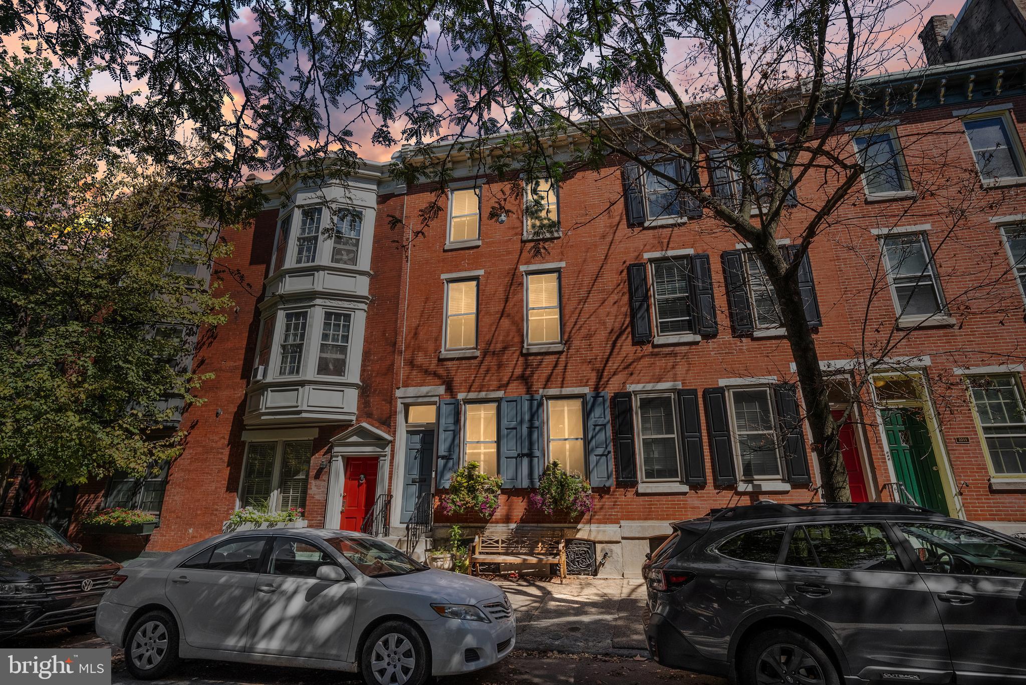 Welcome home to 2215 Pine Street in the heart of charming Fitler Square! This beautifully rehabbed 4 bedroom townhome is a Philadelphia classic with a blend of original details and modern upgrades. Enter through a vestibule and into the living room with a beautiful mantle, high ceilings, white oak hardwood floors, and lovely natural light coming in from the south-facing windows. The dining room, with its custom built-in seating, is the perfect size for intimate family meals and larger celebratory gatherings. Adjacent to the dining room is the newly upgraded kitchen with stainless appliances, quartz countertops, and access to the private back patio, lined in lovely slate for outdoor grilling and dining. The second level features an upgraded hall bathroom with a tub/shower combo and pedestal sink, 2 spacious bedrooms plus a bonus home office! On the 3rd level, you'll find the Master Suite with its lovely south facing windows, custom built closet system, and newly upgraded bathroom with a spacious shower, storage and laundry. Finally, a spacious fourth bedroom completes the third floor. The lower level of this home is finished and the perfect space for a den, playroom, or other bonus room, and is complete with a full bathroom and storage closet. You will love this fabulous location just a half block from Fitler Square park, named by the Philadelphia Inquirer as “one of the most adorable pocket parks in Philadelphia—and maybe all of America,” nearby to local restaurants and shops, the Schuylkill River running/walking/biking trail, and a short walk to Goddard School, the Philadelphia School, Center City offices, CHOP, Penn, Drexel and 30th Street Station.