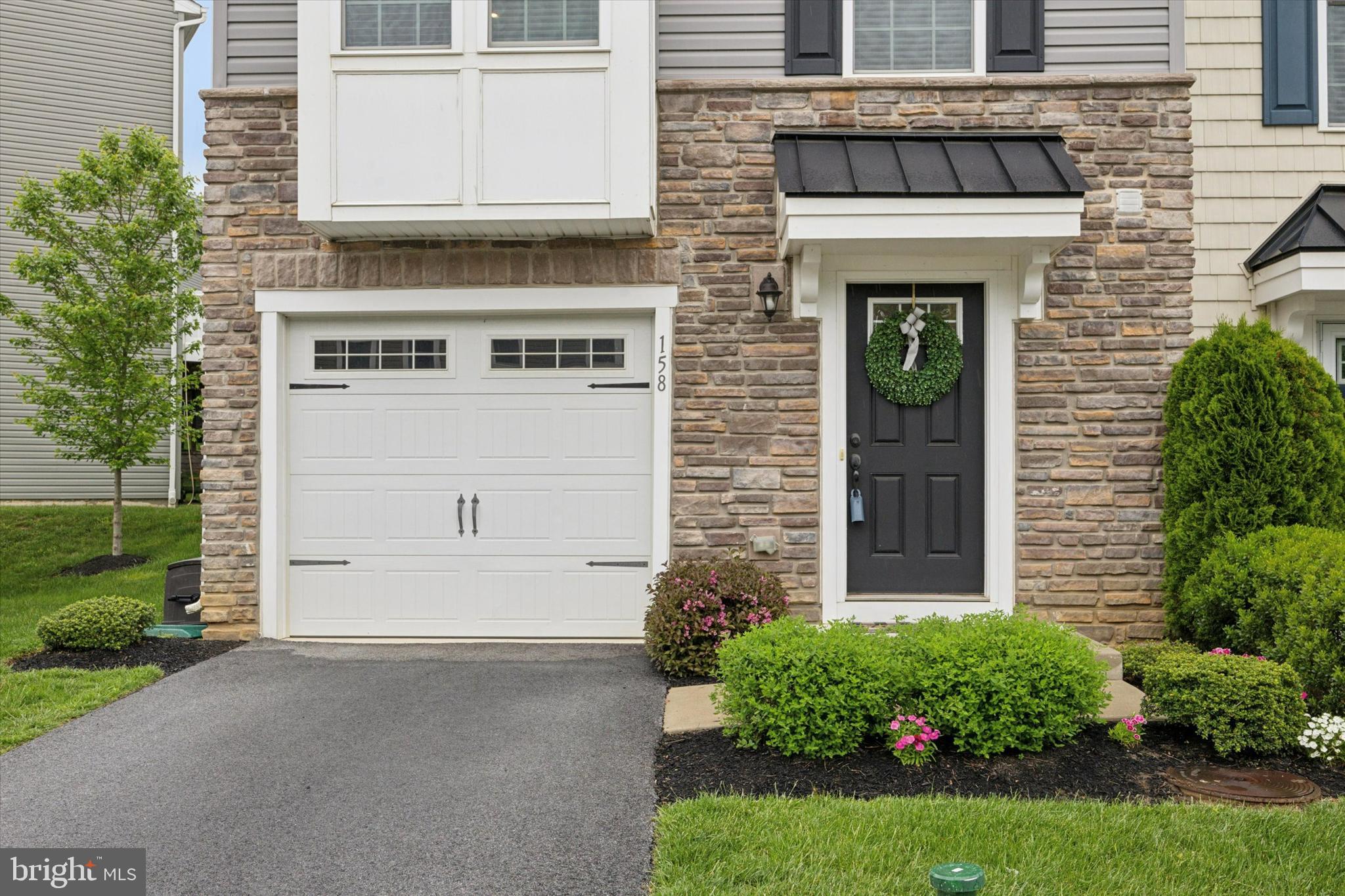 If you have been looking for a move-in-ready home in a super convenient location, your dream home is at 158 Mulberry Drive. The beautifully decorated three-bedroom, 2 1/2 bath townhouse built in 2018 shows like it's new! This home offers a perfect blend of contemporary design and everyday functionality. From the moment you step inside, you'll love the open concept, abundant natural light, and the warm and inviting atmosphere. The family room on the lower entrance level is perfect for adding extra living space, and the powder room is conveniently located on this level. The main floor has a gorgeous kitchen with stainless appliances, a pantry, and sliders in the dining area, and the deck overlooks trees and green space. The living room is spacious and has tons of natural light. There are gorgeous wood floors and wood stairs leading to both levels. There are three bedrooms on the upper level. The primary bedroom with en-suite bath is a lovely retreat. 2 additional bedrooms, a hall bath, and laundry facilities finish off this level. All information, including square footage, should be independently verified. The square footage auto-populated from the tax records; however, it differs from the builder's square footage, which says it's 1917 square feet. The development is also known as Townes at Malvern.
