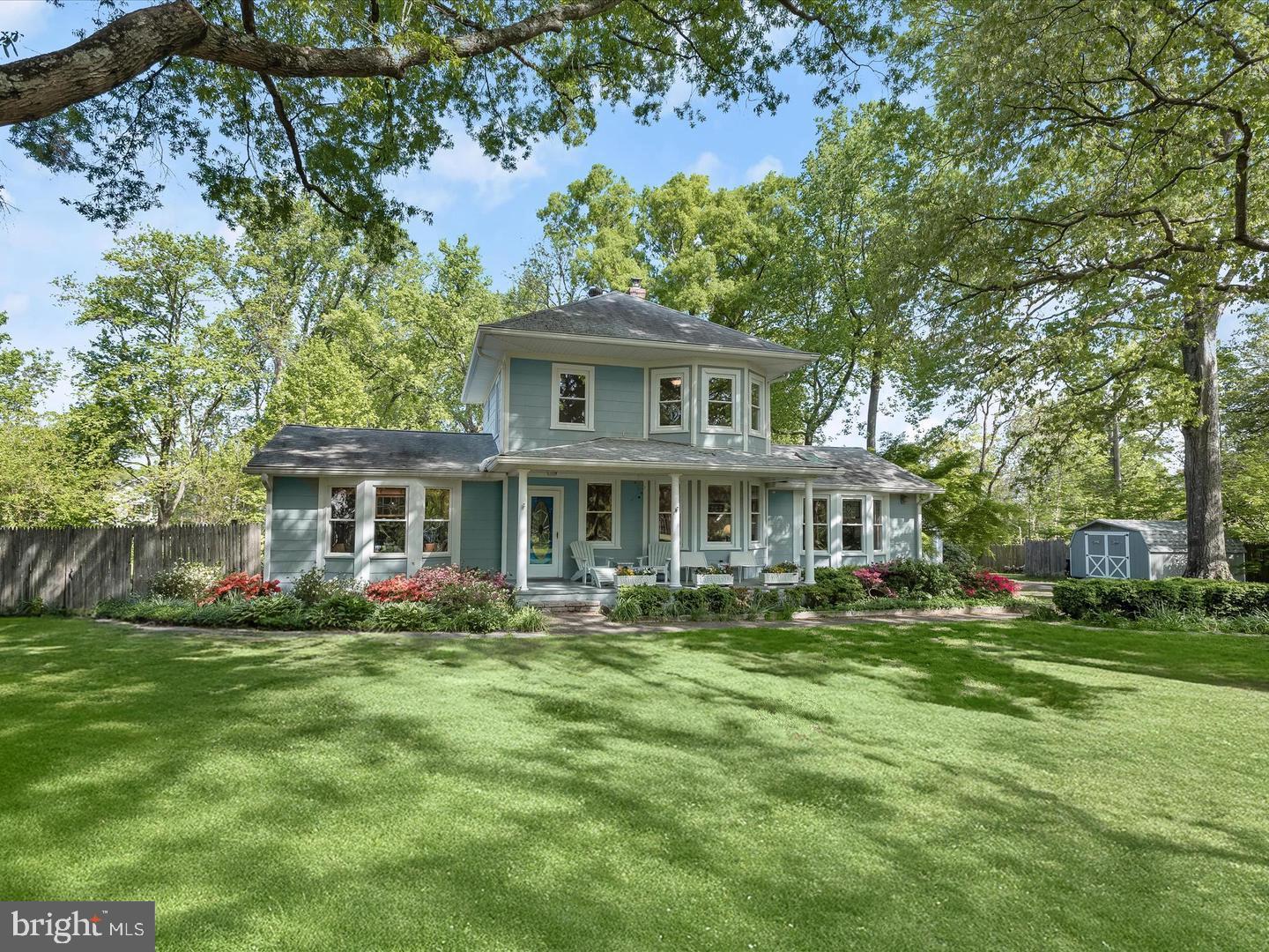 Beautiful Victorian home set on a premium nearly 2-acre lot, tucked away at the end of a long private driveway, plus a 2-car detached garage with garage door opener. A charming covered front porch welcomes you into an open floor plan featuring living and dining areas with reclaimed hardwood flooring, accent molding, and a cozy wood-burning stove. The spacious family room impresses with a soaring cathedral ceiling and skylights that flood the space with natural light. The eat-in kitchen offers timeless style with rich wood cabinetry, crisp white quartz countertops, and a sunny breakfast nook. A main-level primary suite provides comfort and convenience with an en suite bath. A dedicated home office, half bath, and laundry room complete the main level. Upstairs, you'll find a bedroom with its own sitting area, an additional third bedroom, and a full hall bath. The walk-up unfinished basement offers abundant storage/work shop area, geothermal HVAC system Enjoy the outdoors on a large deck, with a HUGE completely fenced in back yard, shaded by mature trees. This landlord is dog friendly, so there is plenty of room for your dog to roam! Ideally located with quick access to major commuter routes and just minutes from shopping, dining, and entertainment.