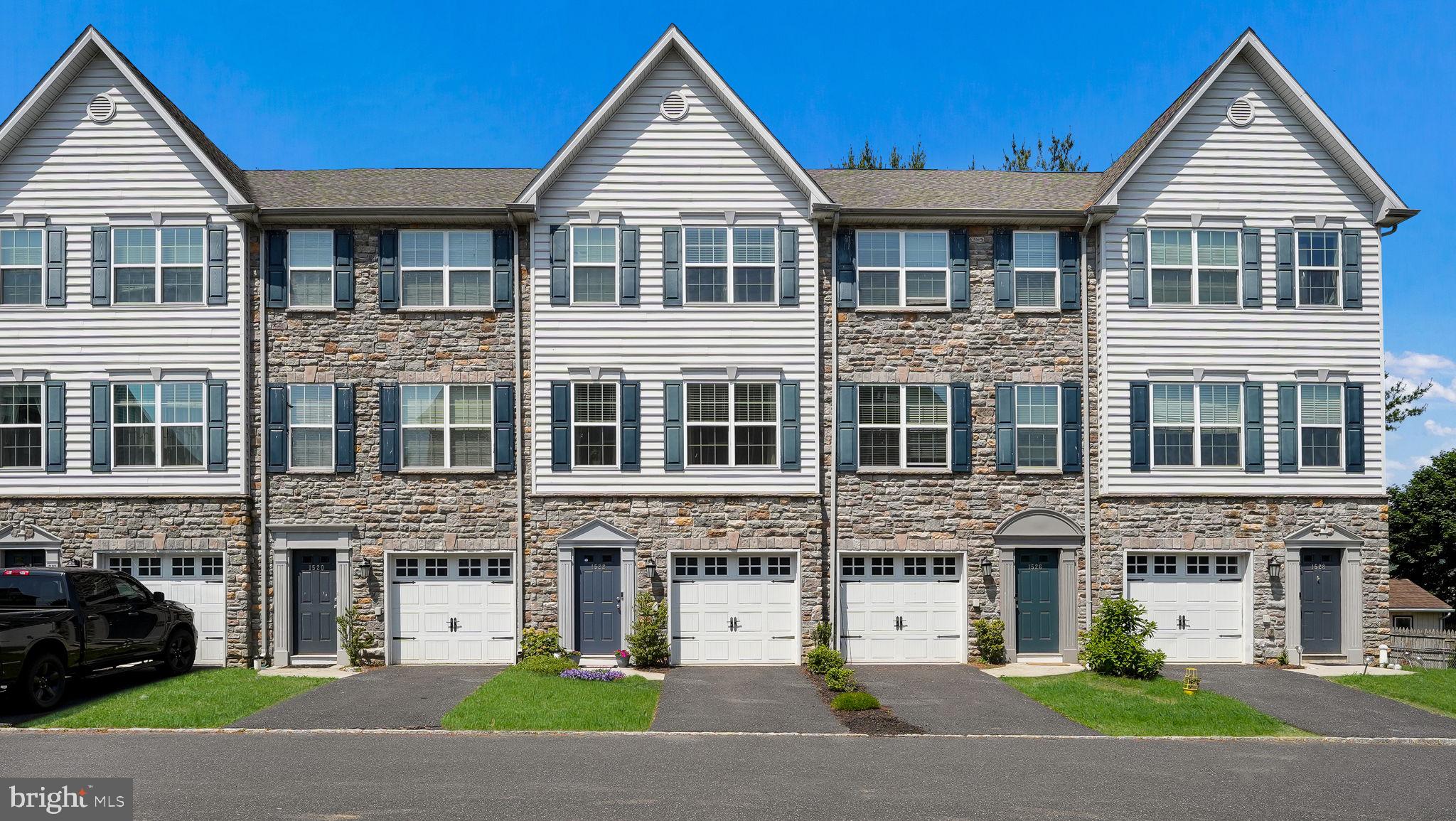 Welcome to The Townes at Stonewood! This beautifully maintained 3 bedroom home, offering 3 full baths, 2 half baths, and a 1 car garage, is located in the highly regarded Saucon Valley School District and ready for its next owner. Step inside to find a welcoming foyer with hardwood floors, the perfect drop zone for everyday essentials. The finished lower level provides flexible space, ideal for a gym, playroom, or secondary living area, and includes a convenient half bath, laundry room with abundant storage, and access to the backyard. The main level is designed with today’s lifestyle in mind, featuring an open-concept layout. A sun-filled living room flows into the gourmet kitchen, complete with granite countertops, stainless steel appliances, a double bowl sink, center island, and generous cabinetry. The adjoining dining/breakfast area is perfect for entertaining, with a second half bath nearby for convenience. Upstairs, the primary suite offers a walk-in closet and a private en-suite bath. Two additional bedrooms and a full hall bath complete this level. The home’s bonus top floor provides incredible versatility, perfectly as a private home office, guest suite, or retreat — complete with another full bath and large storage closet. Enjoy the outdoors on your composite deck with black railings, overlooking green space for summer barbecues or morning coffee. The Townes at Stonewood offer a prime location just minutes from Routes 78 & 412, a short stroll to Hellertown Borough’s shops and restaurants, and close to parks and the Saucon Rail Trail for biking and hiking enthusiasts. Don’t miss the opportunity to make this exceptional property your next place to call home! Ring doorbell at front door.