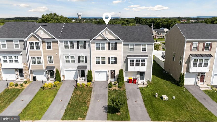 Nestled in the charming Kensington Terrace community, this beautifully maintained Colonial townhouse offers a perfect blend of modern comfort and inviting warmth. Built in 2017, this home features 2,381 sq. ft. of thoughtfully designed living space, including 3 spacious bedrooms and 2.5 bathrooms. The interior boasts luxurious touches such as a soaking tub, stall shower, and a well-appointed kitchen with an island and ample table space, perfect for gatherings. The fully finished basement, complete with a walkout entrance, provides additional living space and easy access to the outdoors. Enjoy cozy evenings in the living area, enhanced by ceiling fans and plush carpeting throughout. The home is equipped with essential appliances, including a built-in microwave, dishwasher, and electric stove, ensuring convenience for everyday living. Step outside to discover the exterior features, including charming bump-outs that add character to the home. The attached garage and paved driveway offer ample parking for you and your guests. Kensington Terrace is not just a place to live; it's a community that thrives on connection. Residents enjoy well-maintained common areas, snow removal, and road maintenance, allowing for a hassle-free lifestyle. Nearby parks and recreational facilities provide opportunities for outdoor activities, while local schools are known for their commitment to excellence. With a commuter rail station just a short drive away, this location offers easy access to urban amenities while maintaining a serene suburban feel. Experience the comfort and community spirit that makes this townhouse a true home.