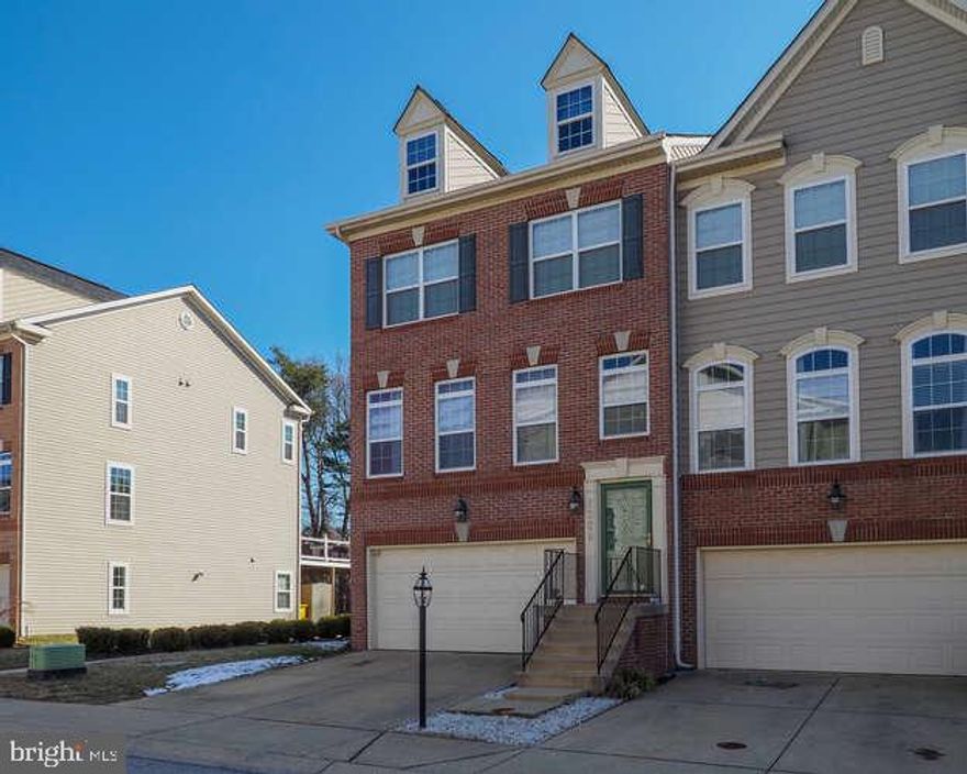 This beautiful spacious townhome offers a 2-car garage, 4 bedrooms, 2 Full baths, 2 half-baths and backs to a wooded area for privacy.  This end unit with a brick front adds lots of natural light.  The primary bedroom easily fits a king-size bed with plenty of space, 2 walk-in closets, a private bath with a dual sink vanity, separate shower and a soaking tub.  The living room is carpeted with 9' ceilings. The kitchen has granite counters with a breakfast island connected to the family room which as a heated ceiling fan.  The family room is also connected to a new large deck completed early 2023,  perfect for entertainment.  With a bathroom on each level, the carpeted lower level is perfect for a family night or large gatherings with access to the patio outside. The recently added 4th bedroom on the lower level is perfect for a private home office.  The community offers 2 dog parks, lap and kid pools, playgrounds, basketball and tennis courts, a community garden center, a fitness center, and walking/running paths, outdoor community events for holidays, social gatherings, and outside movie nights.  Don't miss this opportunity to see this gorgeous home for yourself. Schedule a showing today!
