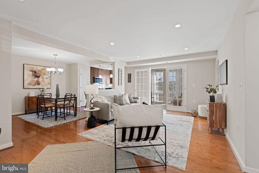 Welcome home to the highly desirable West Village of Shirlington, where modern upgrades, natural light, and unbeatable amenities come together in one beautifully refreshed residence. This spacious 1-bedroom + sunroom condo has been thoughtfully updated and styled, featuring fresh paint, gleaming hardwood floors, and a bright open layout that effortlessly connects the living, dining, and kitchen areas. The French-door enclosed sunroom is a standout — fully surrounded by windows and perfect for year-round enjoyment as a sitting room, reading retreat, office, or intimate dining nook. The updated kitchen is designed for both function and style, offering granite counters, stainless steel appliances, rich 42” cabinetry with display glass fronts, gas cooking, and a breakfast bar for casual dining or entertaining.

The private bedroom is generously sized and complemented by a fully customized walk-in closet, providing exceptional organization and storage. The newly updated bathroom features a beautiful marble-look shower with glass doors, an upgraded vanity, fresh fixtures, and timeless finishes. The convenience continues with an in-unit full-size washer and dryer, additional storage closets throughout the home, and a separate storage unit.

Residents of West Village enjoy some of the best amenities in Arlington, including one of the area’s largest outdoor pools, a clubhouse with lounge and co-working areas, a fully outfitted fitness center, grilling and picnic spaces, beautifully landscaped grounds, ample resident and guest parking, and a free shuttle to Pentagon City Metro — perfect for commuters.

All of this is just minutes to The Village at Shirlington, offering dining, shops, entertainment, trails, parks, and quick access to 395, Pentagon City, Amazon HQ2, Del Ray, and DC. Stylish, turnkey, and effortlessly livable, this condo delivers not just a home — but a lifestyle. Welcome to West Village!