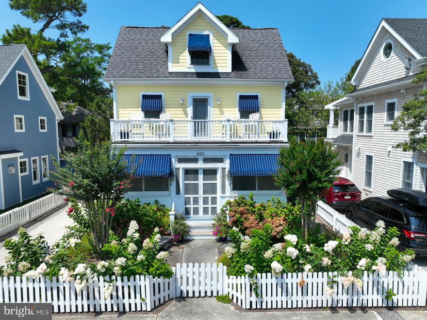 This stunning custom-built South Rehoboth home is just 1 block to the beach & located in one of Rehoboth’s most desirable neighborhoods. Expertly sited on King Charles between New Castle & Stockley St., this bright and airy home offers the ultimate in relaxed elegance with multiple outdoor living spaces that include a screened porch and 3 separate decks for entertaining or spending a lazy day reading a book and relaxing while smelling the salt air and listening to the ocean waves crashing against the shore. Watch the 4th of July fireworks from the front deck! The home's location is ideal, with easy access to the beaches in-town Rehoboth, downtown shops and restaurants, Gordons Pond State Park, the Delaware Bay beaches, and charming Historic Lewes. The extensive bike trail system also provides a great way to explore the local area. With 5 spacious bedrooms and 4 modern baths, this home allows enough room for the entire family or a large group of friends to be gathered at one time. On the 1st level you will find a modern kitchen with large dining area, additional counter seating, family room with gas fireplace, sunroom, 1st floor bedroom with attached full bath, large mahogany deck, a screened porch, separate laundry room with side entrance and an additional living area in the front of the home which offers direct access to the screened porch. An outdoor shower adds to the convenience of coming home from the beach, rinsing off and relaxing. This beach home offers multiple interior and exterior open spaces conducive to entertaining a large family or friends, or small intimate dinner parties. Additional amenities include a 2nd floor office/flex room, plantation shutters throughout, under-counter kitchen lighting, quartz countertops, gas fireplace, random plank pine flooring, multi-zone heating & cooling, large, floored attic space, security system, irrigation, outdoor landscape lighting package and a fully fenced yard. This 3350 sq. ft. home cannot be duplicated based upon current building specifications in-town Rehoboth. Sold furnished and ready to go for the 2024 season. Call for a private viewing today.