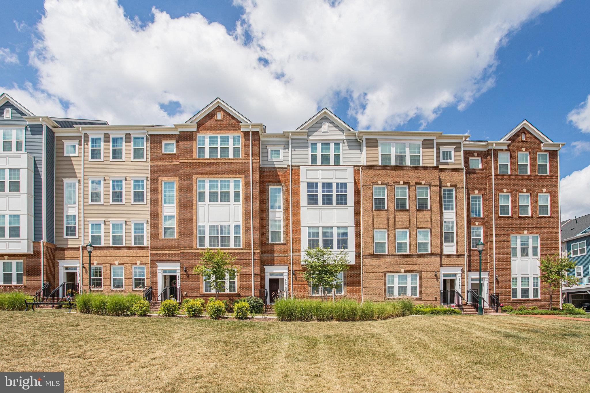 First time rental! This beautiful two level condo townhome built in 2020 is being rented for the first time. Open concept living and dining room with views of the community Amphitheater and lots of natural light and sun. Beautiful wood flooring through main level and stairs to upper level and carpet on bedroom level. The gourmet kitchen features quartz counters, stainless steel appliances including gas range, White cabinets, and island with breakfast bar. Main level has a powder room with access to one car garage. The upper level features a primary suite with walk-in closet and bath with double sink vanity and walk-in glass shower. Two additional bedrooms with a full bath. New washer/dryer in bedroom level is being installed on August 14. Rent includes Water and Sewer. Security System currently installed is $53/month if tenant choose to continue. Walk to local parks, schools, and community amenities. Minutes to I-270, Rt. 355, and public transit. Close to Clarksburg Village Shopping Center with great shops and restaurants. It is available to move in! Rental insurance is required. Tour today!