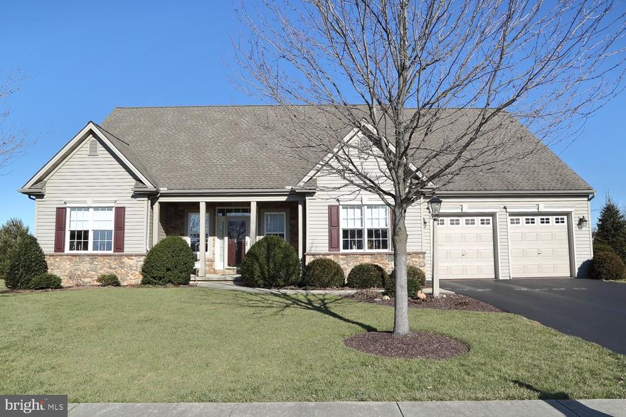 An absolutely stunning home, meticulously cared for inside and out. This custom built home, built by the current owners, boasts of nearly 3600 square feet of  naturally lighted living space. You will certainly appreciate the open, flowing floor plan beginning with a spacious great room and continuing to the dining /kitchen area with a breakfast bar. The cherry kitchen cabinetry, with glass fronts will grab your attention in addition to the Corian countertops with a molded sink, tile backsplash, cooktop stove, double oven, and newer stainless steel appliances. So convenient is the first floor laundry with built in laundry tub. Need a first floor office, its just a few steps away, a nice amenity. If you are looking for some enjoyable fun space, maybe some recreation space, a workshop or possibly an all purpose room, this home has it.  Currently a natural gas wall heater provides the heat to this room, with the option of converting it to a gas fireplace..  This generous size room , approximately 350 square feet, walks out to the patio, and around the corner there is an overhead garage door with a storage area for the lawn mowrer plus other garden tools and supplies, a really  convenient feature. And yes there is a fourth overhead door on the side of the house providing more storage appropriately adjoining the main two car garage. One place you will probably spend a lot of time is the delightful four season room with a perfect view of the gardens, wow! You will adore the owner's suite abounding with warmth and complete with a sitting area, tons of closet space, a very comfortable and pleasant room.
As you walk up to the second floor, there are actually two separate staircases that access the upper level, you have the option of another bedroom suite or multiple bedrooms, the area is incredible! It too has a cozy sitting room, and with the space, it allows you to create that perfect place for your family.  You will find a good sized bathroom which is surrounded with tile, a huge walk in ceramic tile shower, a lengthy double vanity, lots of closet shelving in the walk in closet, along with a linen closet.
Traveling to the basement you'll immediately notice the poured concrete walls, again a wide open area ready to finish as a family room, an additional bedroom, or possibly just as more place to store things. The nice thing, some shelving is already in place.
Some other amenities include a security system, all bathroom vanities have a quartz top, finished garage, wainscoating, all window treatments and radon system.
Outside you will see the lush landscaping with meticulous edging and multiple perennial beds, an absolute delight. Sit on the covered front porch or in back on the patio, great for grilling. A courtyard area with pavers and a powder coated railing accenting the patio making it feel like home. The professionally manicured mature shrubbery and fenced yard create the perfect private setting for those times you need to kick back and relax. A benefit to this home is the the perfect location to downtown Mount Joy with its shopping, various town activites, schools, parks,and of course the train station.
With all the attractive appointments this home offers be sure to schedule your showing!