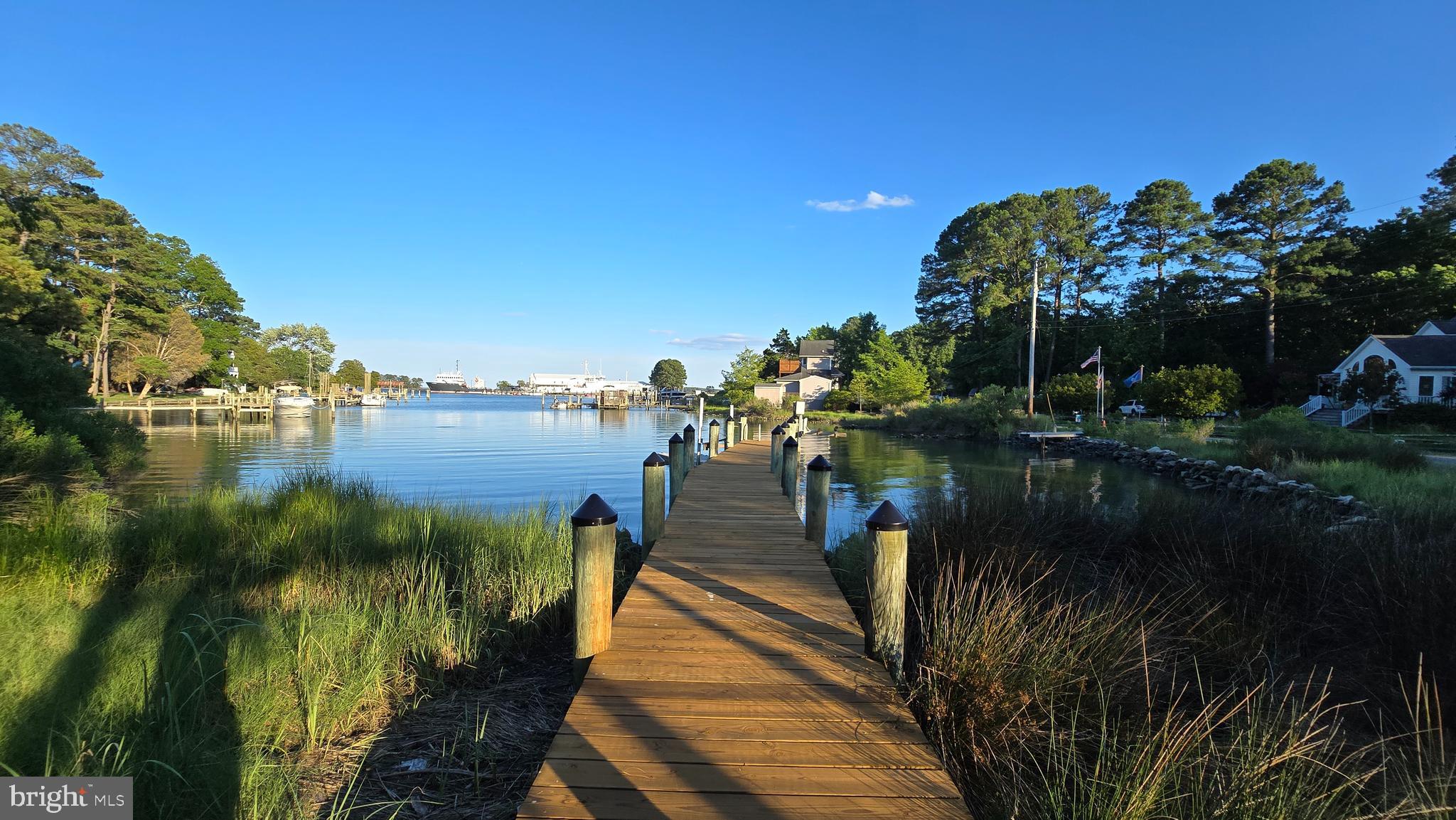 BACK ON THE MARKET - Buyer financing fell through! Experience TRANQUIL LUXURY at Piney Point: Your Perfect Waterfront Retreat Awaits! Step into serenity with this stunning and expansive 3-level waterfront home, nestled on a picturesque corner lot in the charming Piney Point of Historic St. Mary's County. This meticulously maintained property is more than just a house—it's a lifestyle. Boasting a 2-car attached garage, and your very own private pier with a 1,500 lb boat lift, you'll revel in the ease of waterfront living. The newly resurfaced pier is equipped with electric, water, a ladder, and a jet ski floating dock, perfect for all your aquatic adventures.
The open floor plan of this 3-bedroom, 3.5-bath home is designed for comfort and elegance. Enjoy breathtaking water views from almost every room in this expansive residence. The updated features include the resurfaced pier, deck stain, dual HVAC systems, and a whole-house dehumidifier, ensuring year-round comfort. Inside, you'll find a gourmet kitchen with an island and seating, a walk-in pantry, stylish tile backsplash, recessed lighting, and gleaming hardwood floors. The family room is highlighted by a tiled gas fireplace, built-in shelving, and magnificent views of the protected St. George Harbor. Retreat to the upper floor where the bedrooms offer plush carpeting and closet organizers for ample storage. The luxurious primary bedroom features dual walk-in closets and a private balcony with a ceiling fan, perfect for enjoying your morning coffee while overlooking the harbor. The attached primary bathroom offers a walk-in shower, double sinks, and generous cabinetry. The ground level presents a versatile space with a full bathroom, sink with counter space, cabinets, and recessed lighting—ideal for an in-law suite, rental apartment, or expansive bonus room. Step through the sliding door to a covered stone patio, leading to the fenced-in backyard and your private 100 ft pier. Whether you're boating, jet skiing, kayaking, paddleboarding, swimming, crabbing or fishing, this serene setting promises endless relaxation and enjoyment. With NO HOA, you’re free to fully embrace the waterfront lifestyle. ALL THIS is conveniently located just miles from boat ramps/slips, marinas w/ dry docking, fishing piers, chartered boats, state parks, canoe rentals, campgrounds & picnic areas, historic museums & lighthouse, and a variety of dining and shopping options. Plus, you're only 20 miles from the vibrant Solomon’s Island, 13 miles from Pax River NAVAIR, and less than 2 hours from Washington, D.C., and Annapolis. This property is a RARE gem, meticulously cared for, and ready to become your dream home. Schedule your visit today and discover why this waterfront retreat is a MUST-HAVE! Motivated seller!