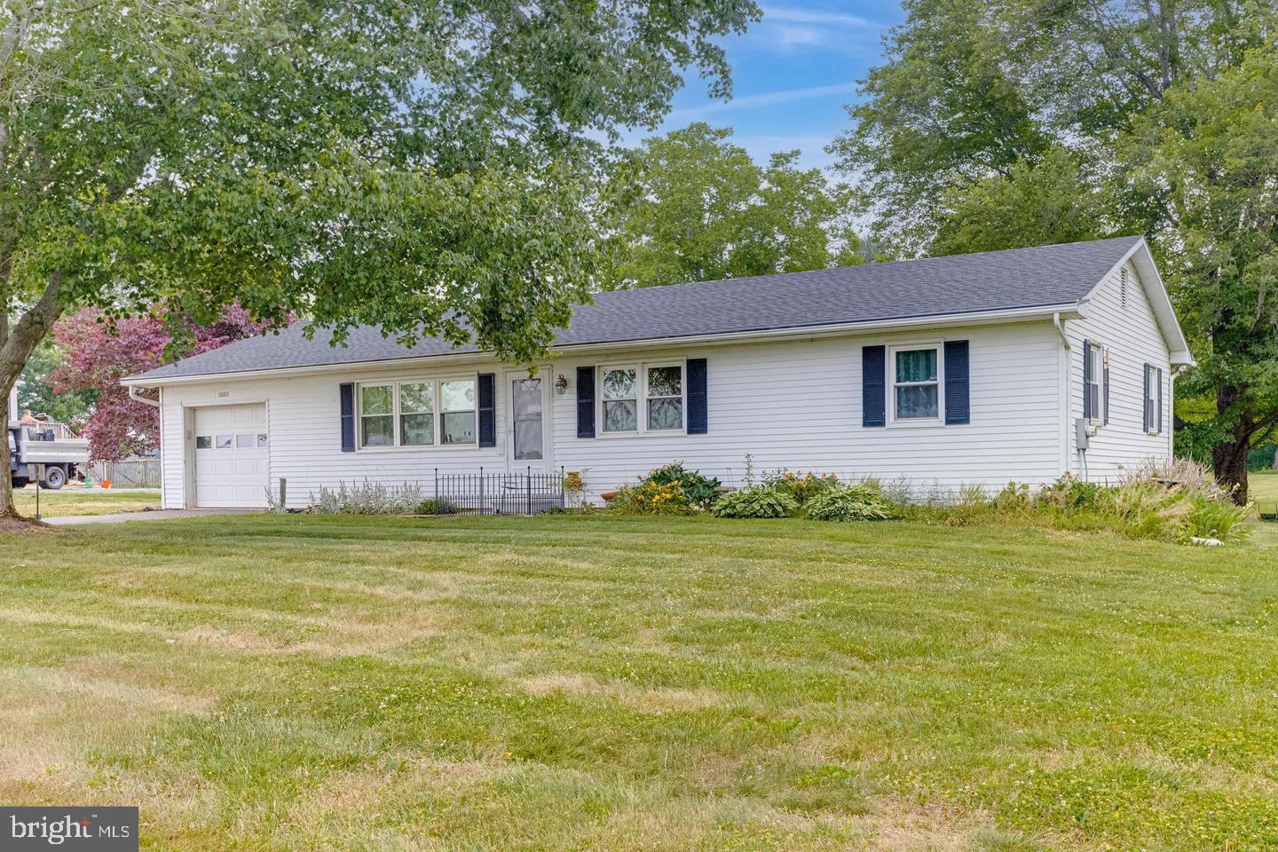 Welcome to 3577 Mill Green Road, a charming raised ranch nestled on 1.24 peaceful acres in the rolling countryside of Street, Maryland. Built in 1973, the home’s warm, frame‑constructed exterior and thoughtful layout offers a rare combination of rural tranquility, timeless character, and practical space—perfect for those seeking a slower pace without sacrificing comfort.
Step inside to discover warm hardwood floors, a spacious living room centered around a brick corner fireplace, and abundant natural light pouring in from the sunroom bump-out—the perfect place to enjoy your morning coffee or watch the seasons change. The open, eat-in kitchen offers generous cabinet space and a window overlooking the property’s scenic backyard.
All three bedrooms are conveniently located on the main level, each with generous closets and calming views of the surrounding trees and greenery. Downstairs, the partially finished basement with interior access provides flexible bonus space—ideal for a rec room, workshop, or home office—and includes a cozy wood stove for chilly winter nights.
Step outside to enjoy a backyard built for both relaxation and adventure. A quaint deck invites gatherings. Mature trees provide privacy, and the agricultural zoning (AG) offers endless possibilities—gardening, small animals, or simply room to roam.
Additional features include a 1-car attached garage, central air, baseboard hot water heat, and no HOA. Th
Located in desirable northern Harford County, you're surrounded by scenic byways, horse farms, and wineries—yet just a short drive from Bel Air, local schools, and commuter routes.
Whether you’re looking for a private escape, a starter homestead, or a forever home with room to grow, 3577 Mill Green Rd is the perfect canvas to make your dreams a reality.
1yr. First American Home Warranty is included.