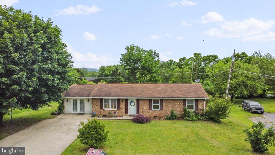 Looking for single level living and no HOA?  This all brick Ranch home is just what you are looking for! This 3 bedroom, 1.5 bath home has hardwood floors throughout the living room, family room, kitchen, hallway, and bedrooms.  Enjoy the deck and the partially fenced backyard. Plenty of extra storage in the 3 sheds sitting in the rear of the yard.  Large driveway with ample parking for you and your guests. Located in a quite neighborhood just minutes from town, shopping and schools.