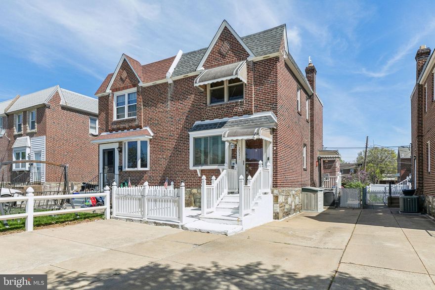 Welcome to this charming 3-bedroom, 1.5-bath twin home located in the desirable Rhawnhurst section of Philadelphia. Nestled on a quiet street, this home offers both comfort and convenience with a private driveway and a spacious, fenced-in backyard. Step inside to a bright and airy living room featuring large front and side windows that fill the space with natural light, complemented by easy-to-maintain vinyl flooring. The open-concept dining room showcases beautiful hardwood floors and flows seamlessly into a kitchen equipped with ample cabinet space and a window that overlooks the serene backyard. Outdoors, enjoy a well-maintained paver patio, a grassy yard perfect for play or gardening, and a handy storage shed. Upstairs, the expansive primary bedroom boasts generous windows and a large closet, while two additional bedrooms at the rear offer peaceful views of the backyard. The recently renovated full bathroom adds modern comfort to this classic home. The basement is partially finished, providing a cozy bonus space with a convenient half bath, while the unfinished section is clean and ideal for a workshop or additional storage, complete with a laundry area. This home is move-in ready and waiting for you to make it your own!