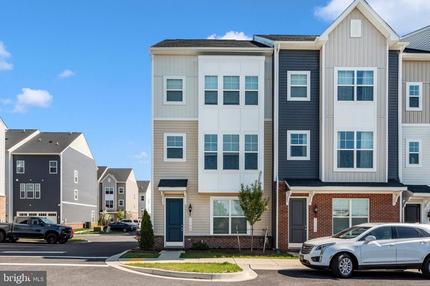 Built in 2024, this stunning end-unit townhome offers modern design, abundant natural light, and a two-car garage in a highly desirable, walkable location. Step into a spacious foyer featuring luxury vinyl plank flooring and an eye-catching staircase. The entry level includes a private office or bedroom with a full bathroom and direct access to the two-car garage—perfect for guests or flexible living.

The main level is designed for everyday comfort and entertaining, with a bright living room filled with natural light from oversized windows. The gourmet kitchen showcases white custom cabinetry with brushed nickel hardware, quartz countertops, stainless steel appliances including a gas cooktop and double oven, and a large island with bar-stool seating. A dedicated dining area off the kitchen creates an ideal space for gatherings, along with a convenient half bath on this level.

Upstairs, the spacious owner’s suite features a walk-in closet and a private en-suite bathroom. Bedrooms two and three are generously sized and share a full hall bathroom.

Enjoy the ultimate convenience of modern living with restaurants, gyms, spas, shops, cafés, and more just steps from your front door—everything you need, right where you want it.