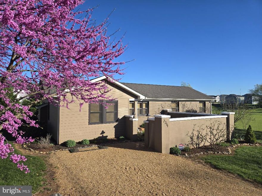 Welcome to this exceptional ranch-style home that perfectly balances modern comfort with distinctive character. Completely renovated in 2016 adding additional square footage to the main level, this home showcases meticulous attention to detail and premium craftsmanship throughout.

Step inside to discover an inviting open floor plan that seamlessly connects living spaces, featuring beautiful hardwood flooring. The living room and dining room serve as a welcoming gathering space, anchored by a cozy gas fireplace that adds both warmth and ambiance. Beautiful, aged beams sourced from local materials add architectural interest and rustic charm to the ceiling, creating a unique aesthetic that sets this home apart. Natural light floods the welcoming sunroom, equipped with premium PGT windows that create an ideal space for relaxation or enjoying morning coffee while overlooking the colorful landscaping.

The kitchen is outfitted with stainless steel appliances and elegant quartz countertops. Custom soft-close cabinetry, while a special feature includes a handcrafted reclaimed oak countertop that adds character and functionality. The thoughtful design extends to built-in storage solutions throughout the home, maximizing space efficiency without compromising style.

This three-bedroom, three-bathroom home offers the convenience of main-level living while providing versatile spaces for various needs. The primary bedroom suite provides a private retreat, while a finished basement adds valuable living space, including a bedroom with an en-suite bathroom and spacious bonus room– perfect for guests or a private home office setup. Each bedroom includes an on suite bathroom.

The exterior combines brick with modern Hardie Plank siding, offering both curb appeal and durability.
The outdoor space has been thoughtfully designed for entertaining, creating seamless indoor-outdoor living opportunities. This truly one-of-a-kind home combines the best of modern amenities with unique architectural elements, creating a living space that's both functional and full of character.
The home's location is situated in a convenient in-town setting on just over a half acre lot that puts everything within easy reach that commuters will also appreciate. Outdoor enthusiasts can enjoy quick access to Rockwater and Yowell Meadow Park for recreation and fresh air.

Whether you're hosting friends and family or seeking a peaceful retreat, this home offers the perfect blend of style, comfort, and convenience. The attention to detail, quality craftsmanship, and exceptional location make this property an outstanding opportunity for those seeking a distinctive home in a prime location.