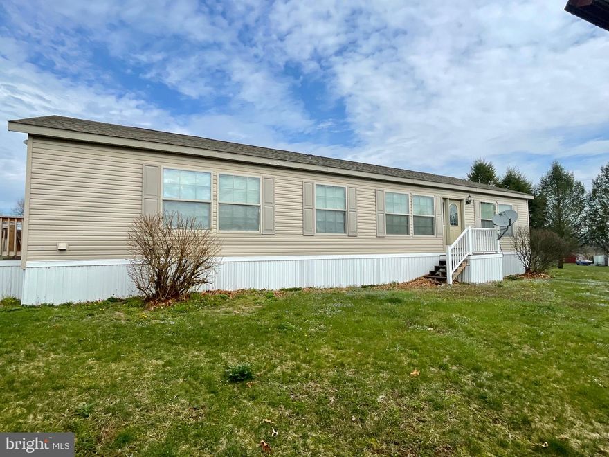 This spacious 3 bedroom ranch has a split floorplan. The wide open Great Room with stone wood-burning fireplace opens to a huge kitchen with New Stainless appliances, island seating and nice dining area. The owner's suite features a large bath with double vanity and corner tub with great walk-in closet. The second & third bedrooms are off the kitchen with hall bath between. The laundry sits off the kitchen too. Lots of Fresh paint. New carpet, New Roof, New Hot Water Heater and  Off-street parking.  Xfinity high speed internet is available.