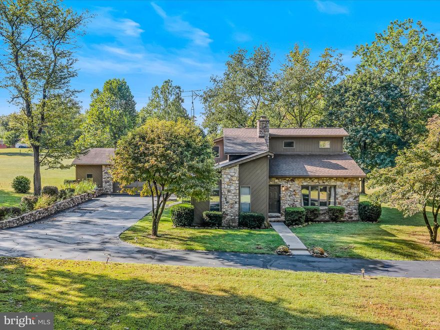 Welcome to 1250 Mish Rd in Bunker Hill, WV, a CUSTOM turnkey retreat loaded with 2023 updates including a new roof, HVAC system, commercial-grade hot water heater, appliances, luxury vinyl plank and carpet, fresh paint, modern lighting, and a whole-house water treatment system.
Light pours in through premium Anderson windows, creating bright, energy-efficient spaces anchored by a cozy wood-burning fireplace. The partially finished basement features a finished laundry room with a stand-up shower and is ideal for a rec room, home gym, or guest suite. On the main level, a flex room easily serves as a 4th bedroom or private office. Hidden beneath the back porch, a cistern adds extra water storage and reliability, perfect for gardening, outdoor projects, or an additional water reserve, an invaluable feature for country living.
Outside, the oversized detached garage with its own bathroom is a standout, offering ample space for vehicles, a workshop, or even a home-based business. Enjoy the outdoors with mature trees, peaceful surroundings, and a just a short walk to the public access at Mill Creek bridge with seasonally stocked trout.
This property blends modern updates, flexible living spaces, and outdoor beauty, a rare find that’s ready to move in and enjoy.