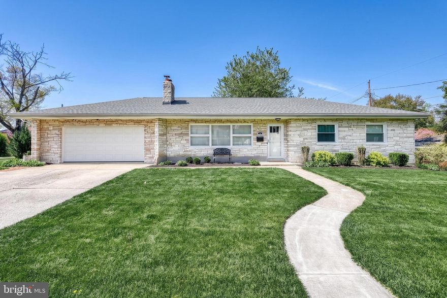 This exceptionally well maintained ranch home offers the ease of one floor living on a spacious ⅓ acre corner lot in a highly desirable Camp Hill location. From the moment you arrive, you’ll notice the extensive updates and pride of ownership throughout. Major improvements include an architectural roof (2019), an energy-efficient heat pump (2023), a new hot water heater (2023), and beautifully updated bathrooms (2020 & 2025). Step inside to a warm and inviting living room featuring gleaming hardwood floors and a striking stone fireplace. The formal dining room is filled with natural light and showcases charming architectural details including a built-in bookcase, an arched doorway, chair rail, and a picturesque window overlooking the rear yard. The kitchen offers abundant cabinetry, a smooth-top range, double bowl sink and peninsula island. Two impressive updated bathrooms feature tile floors, new vanities and designer finishes that truly impress. The home includes three generously sized bedrooms, along with all-new two-panel Craftsman-style interior doors for a fresh, cohesive look. The finished lower level provides versatile space ideal for a rec room, playroom, home gym, or office. Outdoor living is just as enjoyable with a fully fenced backyard and convenient basement stair access. A standout feature is the oversized two-car garage, complete with two walls of windows that flood the space with natural light, perfect for hobbies, entertaining, or a unique indoor/outdoor gathering area. Additional highlights include all masonry exterior and a fully fenced yard for privacy and functionality. Conveniently located in Lower Allen Township, this home offers easy access to shopping, dining, hospitals, and banking. Just minutes from I-83, you’ll enjoy seamless travel throughout Central PA. Interior photos coming soon. Showings begin Saturday, May 2nd. Call today for more information or to schedule your private showing.