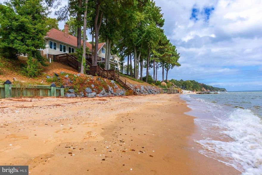 Picture perfect coastal living custom built Chesapeake Bay beachfront home with spectacular views, 180  RipRap shoreline and sandy beach laidback leisure. Transitional style framed by mature landscaping w/ irrigation system, Bay side deck & covered patio w/stairs to beach. Recent interior updates. Minutes to charming Solomons Island, dining, marinas, and premier boating, fishing & cruising waters.