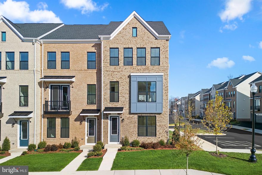 Come claim your dream END-UNIT TOWNHOME by Van Metre Homes at WEST PARK to be delivered NOVEMBER 2024. Offering an impressive 2,496 square feet spread across four levels, this stunning residence boasts 3 bedrooms, 2 full and 3 half bathrooms, and a convenient 2-car, rear-load garage. As you enter, the main level welcomes you with an inviting open floor plan highlighted by 9' ceilings. At the heart of the home separating the dining room and great room, the spacious premier kitchen awaits, a culinary haven, complete with a kitchen island, upgraded cabinets, quartz countertops, tile backsplash, and stainless-steel appliances. Venture to the upper level and discover an indulgent primary suite boasting a generous walk-in closet and a spa-like 4-piece luxury bathroom. Pamper yourself in the oversized, frameless shower with a built-in seat and enjoy the convenience of double sinks. This level also hosts 2 additional bedrooms, 1 full bath, and a well-placed laundry room. But the luxury doesn't end there. Ascend to the top level and be captivated by a spacious, finished loft, complete with a half bathroom and a private roof terrace, an ideal space for effortless entertaining of family and friends. On the ground level, discover a welcoming foyer with a multipurpose rec room with half bathroom and easy internal access to the large garage with electric car charging capabilities! Being a new build, your home is constructed to the highest energy efficiency standards, comes with a post-settlement warranty, and has never been lived in before! This residence is not just a house; it's an experience, a harmonious blend of thoughtful design and contemporary luxury. Make your move now. Schedule an appointment today! ----- Welcome to West Park III, a vibrant neighborhood of dreamy townhomes with rooftop terrace options in the award-winning community of Brambleton, VA. Experience an exceptional living experience in Brambleton, a flourishing community where modern living meets suburban charm. This family-friendly community offers miles of trails, tot lots, parks, pools, highly sought-after schools within walking distance, and so much more at your fingertips. With the bustling Brambleton Town Center just down the street, you can enjoy endless shopping, dining, and entertainment options. Rise to new heights at West Park III and experience the perfect blend of comfort, convenience, and connectivity—a place where cloud nine is just the beginning. ----- Take advantage of closing cost assistance by choosing Intercoastal Mortgage and Walker Title. ----- Other homes sites and delivery dates may be available. ----- Pricing, incentives, and homesite availability are subject to change. Photos are used for illustrative purposes only. For details, please consult the Community Experience Team.