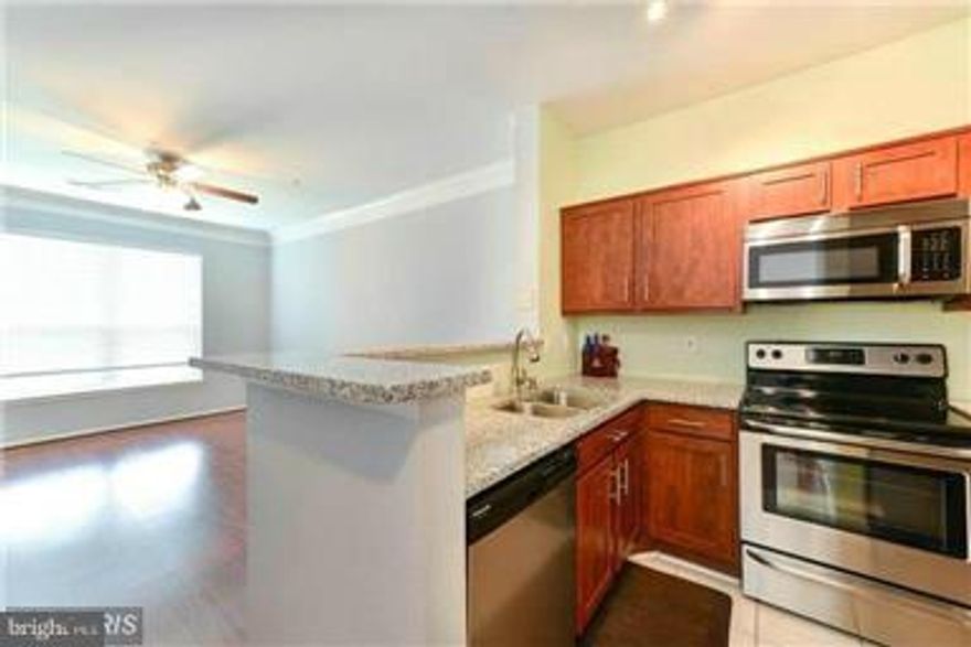 Beautiful One Bedroom End Unit with Garage Parking!  Granite Counters, Decorative Cabinets, Wood Floors, Stainless Steel Appliances, Laundry Room in Unit, Private Tree View & Balcony. Convenience and Location, Walk to the Metro! In the Heart of Tysons Restaurants, Night Life, and Shopping! Gated Community with Pool, Fitness Room, and Jogging Trail.