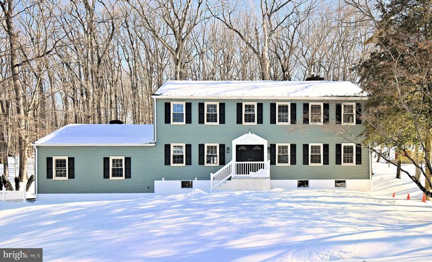 Welcome to 2980 Yorkshire Road in Doylestown, a fully renovated colonial set on a private, wooded lot that blends classic charm with modern upgrades throughout. This spacious 5-bedroom, 3.5-bath home offers over 3,000 square feet of finished living space, thoughtfully redesigned for today’s lifestyle.

The main level features wide-plank flooring, abundant natural light, and an open, flowing layout ideal for both everyday living and entertaining. The stunning, brand-new kitchen is the heart of the home, showcasing white cabinetry, granite  countertops, stainless steel appliances, a large center island, and modern lighting, seamlessly opening to the dining and living areas. A striking stone fireplace anchors the living space and adds warmth and character.

Upstairs, generously sized bedrooms include a beautifully updated primary suite with a spa-like en-suite bath, custom tile work, and contemporary finishes. All bathrooms throughout the home have been fully renovated with modern vanities, fixtures, and designer tile.

The home features a full basement, offering excellent ceiling height and abundant space for storage or future finishing ideal for a home gym, media room, or additional living area tailored to your needs. Not to mention the  walk up  attic for additional storage with new insulation.

Major mechanical upgrades include a brand-new HVAC system with dual-zone heat pumps, providing efficient, year-round comfort, along with a new hot water heater and roof for peace of mind. Every detail of this home has been refreshed, from flooring and lighting to systems and finishes.

Outside, enjoy the serenity of a wooded setting with ample space for outdoor entertaining, relaxing, or future enhancements. Conveniently located near Doylestown Borough, shopping, dining, and top-rated Central Bucks schools, this move-in-ready home offers the perfect combination of privacy, space, and modern living.

Nothing to do but move in and enjoy.