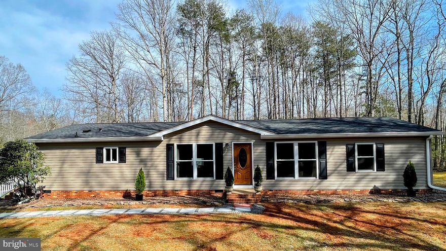 Welcome to your new ranch style home in the beautiful Orange County, VA.

This is a great buy - great value for the money: the lot is about 2.15 acres, the house has an open space of close to 1,800 square feet, the 2 car detached garage is finished and the driveway is circular with plenty of space for your cars, trailers, RV and farm equipment.

The house and garage have been completed remodeled and updated in the past 5-8 years to include roof, gutters, custom double hung windows and doors, kitchen and bathrooms with hardwood and tile floors, along with newer HVAC, plumbing and electrical panel.

There’s plenty of storage space in the kitchen cabinets with self closing drawers, countertop including an island and custom pantry shelves. Relax and enjoy your favorite TV show on the large living room. Get some work done from your desk with a nature view. The dining room has easy access to both the kitchen and deck. There’s a large primary bedroom for a king size bed with a walk in closet and a big bathroom with a custom tile shower and a double vanity. The other 2 bedrooms are spacious and share a full bathroom with a tub. There’s a powder room near the laundry / mud room area.

Private well and conventional septic makes for a low cost living and low maintenance - affordable and budget friendly.

Bring your imagination and take advantage of large yard surrounded by trees for your privacy . This house is meticulously maintained and in a pristine condition that is sure to impress.