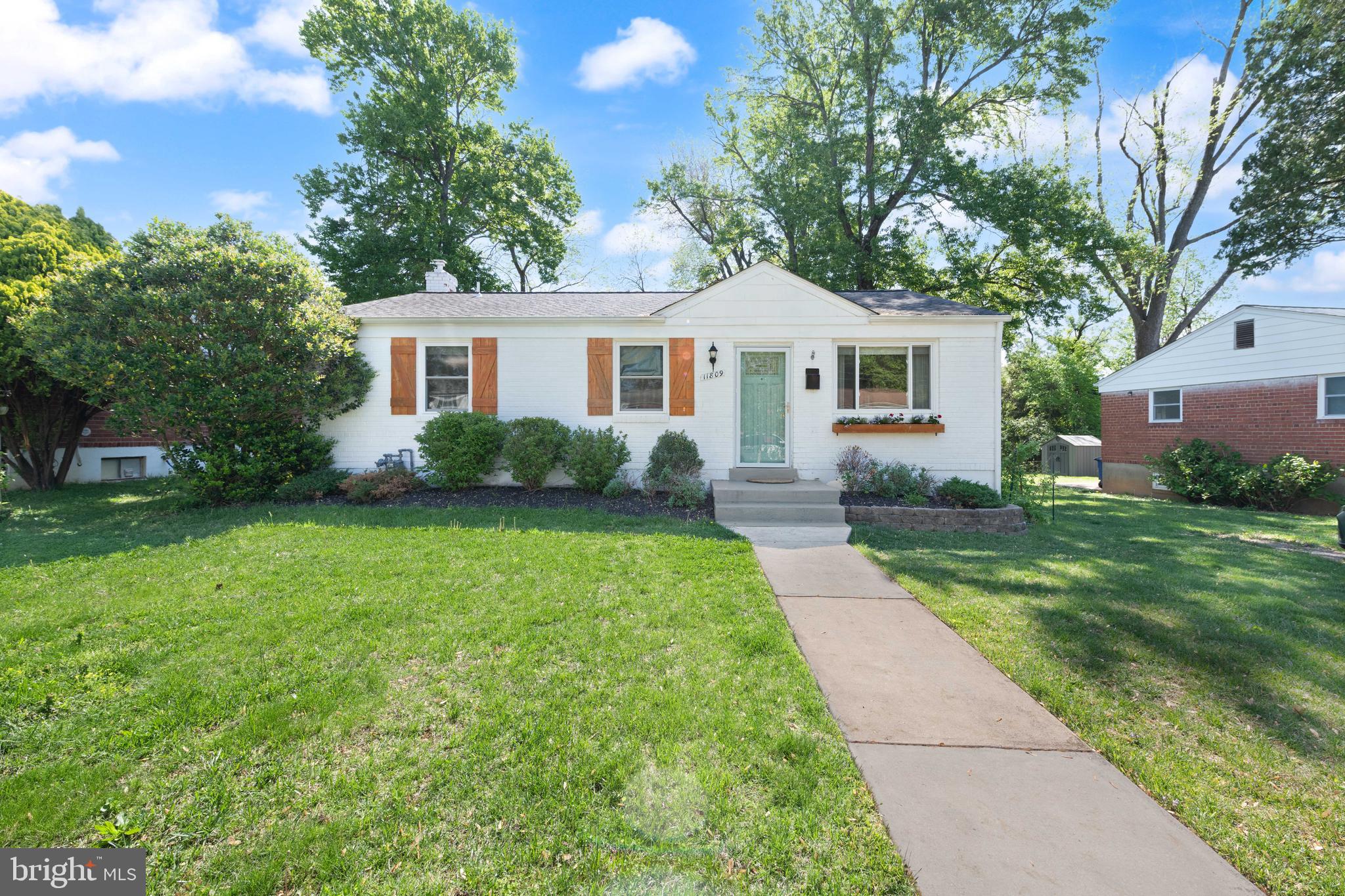 Welcome to this beautifully updated and delightfully charming rambler, tucked on a quiet street in the sought-after Randolph Hills neighborhood. This 3-bedroom, 2-bathroom home blends comfort, convenience, and style across two fully finished levels.
The main floor features handsome flooring, a renovated full bath, and a gourmet kitchen with stainless steel appliances. The adjoining dining area includes cozy built-in banquette seating—perfect for casual meals or lingering over coffee.
Downstairs, the fully finished lower level offers flexible living space with plush carpet, a second renovated full bath, spacious laundry room, and plenty of storage. There’s also room to easily add a fourth bedroom, creating even more versatility to suit your needs—whether it’s for guests, a home office, or multigenerational living.
Step outside to a large, flat backyard with a brand-new fence, covered patio, and storage shed. This outdoor space is ready to become the garden or entertaining oasis of your dreams.
Additional updates include newer windows throughout, roof replaced (2016), kitchen range, washer and dryer (2021), and dishwasher (2025). Enjoy unbeatable proximity to Rock Creek Park, Randolph Hills Local Park, and Rock Creek Trail, plus Whole Foods, Pike & Rose, and the countless shops and restaurants of Rockville and North Bethesda. Commuting is a breeze with quick access to I-270, the 495 Beltway, Garrett Park MARC (1.1 mi), White Flint Metro (1.2 mi), and multiple bus stops.
11809 Old Drovers Way offers charm, flexibility, and convenience—come see what makes this home so special.