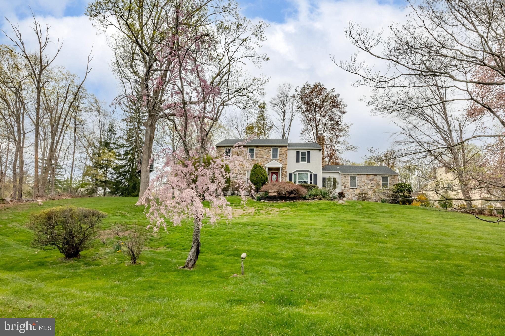 Perfectly perched on close to an acre lot sits this beautiful 4 bedroom, 2.5 bath center hall Colonial home that has been loved and updated for decades by its current owners. 481 Jacques Ln offers the best of everything with its amazing location in the award winning Rose Tree Media school district, proximity to Media Borough, an updated and move-in ready appeal and plenty of versatility in its spacious floor plan! When you pull up to this home you will instantly fall in love with the park-like setting, mature landscape and weeping cherry trees. Pull up the long driveway and enter at the front door. The center hall foyer greets you. The first floor has a modern and spacious flow to include a large living room with large windows, giving you a view of the lush landscape and oak hardwood floors. The living room leads right into the formal dining room. The true eat-in kitchen has been updated with modern cabinetry, Corian countertops, peninsula, built in desk area, stainless steel appliances and a breakfast room with vaulted ceiling with doors leading out to the beautiful brick patio, perfect for hosting bbq’s and enjoying your morning coffee. The first floor family room with it's bay window seat and fireplace is the perfect space for relaxing and also offers a beautiful view of the property. The home office is large and accessed through glass French doors. This room would also make a great playroom. The oak flooring continues through the living areas of the first floor for a nice cohesive feel, making it easy to decorate in your own way. The powder and laundry rooms are perfectly tucked away and so is access to the attached interior access garage. Upstairs on the second floor you will find an owners suite with a large bedroom, thoughtful and custom built in closet space and a large tiled bath with shower, jacuzzi tub and large vanity. All 3 other bedrooms are large in size with ample closet space and there is a large hall bath. The lower level offers tons more living space and a 5th bedroom opportunity! Enjoy the large rec room for kids to play, and an enclosed room with a closet, perfect for overnight guests or another home office. The large walk in pantry is great for your overflow kitchen items and holiday decor. The unfinished utility room has tons more storage space if needed. The beauty of this home is how it sits on the lot. Because there are no homes directly in front or on either side, the natural light that pours in gives it a warmth that is hard to come by. The current owners have loved it so much and so will you. There are many upgraded features such as the whole house generator, newer windows, roofing, AC, new driveway, on demand hot water heater and newer fireplace. The home has been freshly painted throughout making it easy to move right into! Enjoy close proximity to Ridley Creek State Park (across the street), an open nature view out the front of the home, great square footage, a finished lower level, a convenient back patio for entertaining and a beautiful neighborhood to enjoy all year round. Each home is unique with centuries old farm houses nearby, one of the best town centers in the area, award winning schools and easy access to all major thoroughfares and the airport. This special home is calling your name- answer it!