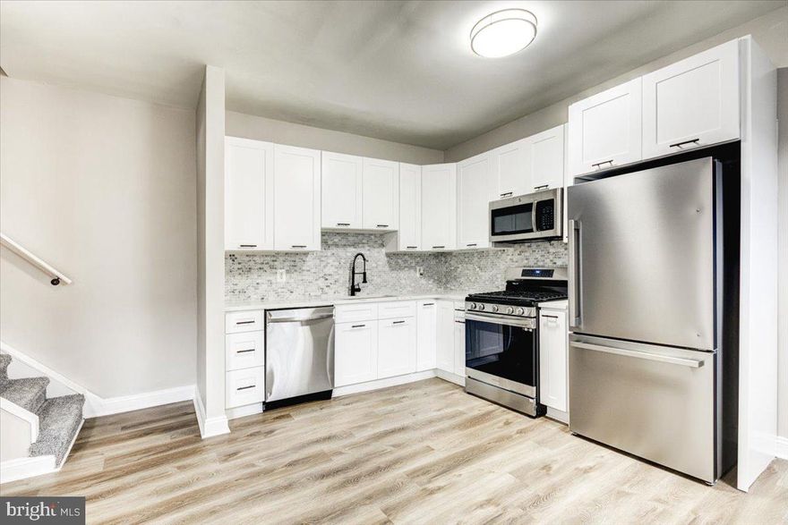 Come and see this Beautiful renovated end of group townhome! Gleaming floors, updated kitchen, enormous bathroom, and much more.  One of the largest homes in the neighborhood. Conveniently located a few minutes from downtown and 695. Come and check this out today before it's gone!