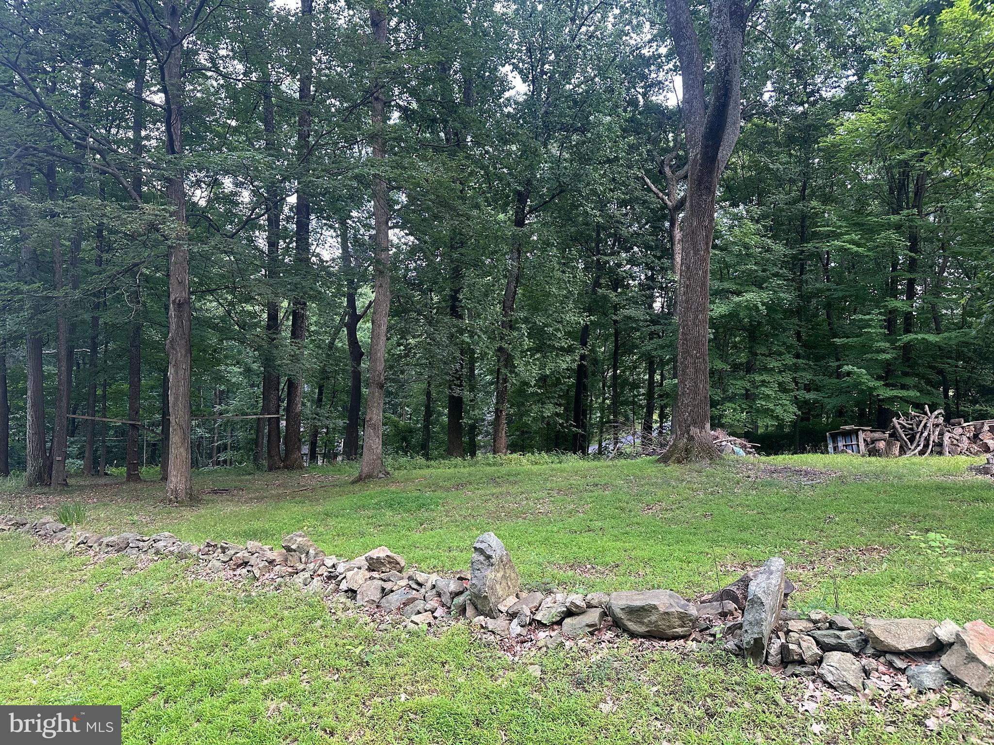 Larger .65 acre lot for sale with approved septic! There is a nice flat spot on this property to put your future home with a few large trees to retain for some summer shade. Come take a look to see if this might be the perfect lot to build the home you've been anxious to start!