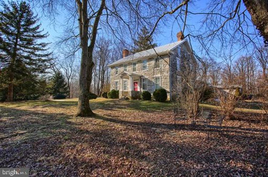 Beautiful Stone Farmhouse Style Home situated on a peaceful 4+ acre lot in Dickinson Twp.  This property is a Fly Fisherman's dream!  Home sits along the peaceful Yellow Breeches.   Built in 1862 , this home was built with double stone walls to give superb insulation both summer and winter.  BRAND NEW energy efficient heating system with 3 zones recently installed.  Home features large formal dining room, double parlor, eat-in kitchen with wood stove.  Mud room connects main house to full bath and office, formed of the original summer kitchen.  Tranquil and private large screened porch faces lawn and woods along creek front.  There are 4 bedrooms and the 2nd full bath on the 2nd floor.  Original beautiful hard wood floors, some have recently been refinished.   2 car detached garage with 2nd level that could be used as an office, game room or possibly a studio.  3 parcels totaling 4.29 acres.  Parcel w/ home assessed at $309900 and the other two lots assessed at over $111,000 together. Mountain Views and close to State Parks!