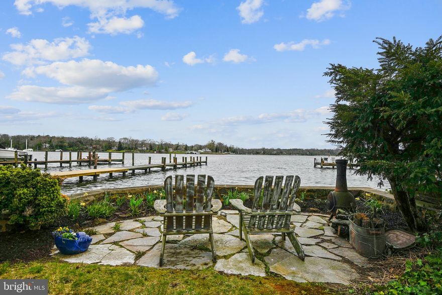 This timeless summer cottage on the Magothy River is truly a unique waterfront retreat, and offers the potential to build the custom waterfront home of your dreams.  For boating enthusiast, the deep water and pier can accommodate both power and sailboats on one of the most popular rivers accessing the Chesapeake Bay.  A unique stone retaining wall extends along the waterfront with steps leading to a sandy beach that appears at low tide.  Located on a quiet street in the community of Arundel Beach, this property offers fantastic waterfront living with Severna Park shopping and dining amenities minutes from your front door. 

The original clapboard cottage was built in the 1920’s, and has served as a summer home for many generations.  You will be instantly drawn into the main living room with french doors opening to the screened porch and water views.  The entire cottage is wrapped in vintage wood bead board, featuring a cozy living room with a wood burning fireplace and charming bathroom with an authentic clawfoot tub.  There is a bedroom on the main level, and two additional bedrooms upstairs. 

This property not only offers a beautiful waterfront, but also backs to a quiet nature preserve.  Thanks to a Forest Stewardship Plan with Maryland DNR, the large forested area on the opposite side of Maple Road is preserved as permanent green space.   
Enjoy this lovely home as the seasonal cottage that has served families for generations, or spend the summer on the screened porch planning the waterfront home of your dreams.  This one is a rare opportunity.