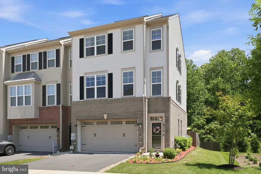 Welcome to one of Bradford’s Landing’s premier end-unit townhomes, perfectly positioned on a premium lot backing to trees and parkland for exceptional privacy and peaceful wooded views. Built in 2020 and beautifully maintained, this sun-filled home offers over 2,650 square feet of finished living space and features the highly desirable 4-foot extension on all three levels, creating noticeably larger rooms and an expansive feel rarely found in townhome living.

Thoughtfully designed with today’s lifestyle in mind, this home includes the sought-after optional enclosed study with elegant glass French doors, creating the perfect private home office, playroom, library, or flexible living space.

The main living level showcases a stunning gourmet kitchen featuring quartz countertops, a large center island, stainless steel appliances, pantry, abundant cabinetry, and seamless flow into spacious dining and living areas designed for both entertaining and everyday living. Expansive windows on multiple sides flood the home with natural light while showcasing the peaceful wooded setting unique to premium end-unit living. Step directly from the main level onto a private deck overlooking trees and green space.

The upper level features a spacious primary suite complete with a walk-in closet and private bath, along with two additional bedrooms, a full hall bath, and convenient upper-level laundry.

The finished walkout lower level offers a spacious recreation room with a full bath and direct access to a beautifully designed paver patio and fenced rear yard, creating a seamless indoor-outdoor living experience and exceptional space for relaxing or entertaining.

Life at Bradford’s Landing extends far beyond the home itself. Residents enjoy community amenities including a dog park, expansive open green spaces, multiple playgrounds, gazebos, and scenic walking and jogging trails. Nearby wooded trails connect directly to East Norbeck Park, featuring baseball and soccer fields, pickleball and basketball courts, playgrounds, picnic and cookout areas, and additional recreational spaces. Enjoy a true neighborhood atmosphere where outdoor living, walking, recreation, and nature become part of everyday life.

Additional highlights include ample recessed lighting throughout, extensive landscaping and hardscape, a two-car garage with driveway parking, and a low-maintenance lifestyle in one of Bradford Landing’s most desirable locations.

Conveniently located near the ICC, Route 97, shopping, dining, and major commuter routes, this home delivers the perfect combination of modern design, privacy, convenience, and outdoor living.
