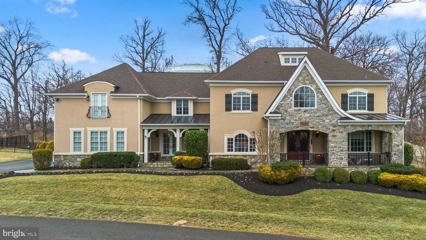 Significant price improvement—schedule your tour today! 
Welcome to a residence where architectural elegance, thoughtful design, and exceptional craftsmanship come together to create a one-of-a-kind living experience. Nestled in one of the area’s most prestigious neighborhoods and within the top-ranked Wootton School District, this custom estate offers over 9,000 square feet of refined living space—all within walking distance to shops, restaurants, and daily conveniences.

From the moment you step into the grand two-story foyer—featuring a dramatic curved wall and elegant stone flooring—you’ll feel the sense of scale and sophistication that defines this home. A wide hallway leads into the heart of the house: a spectacular chef’s kitchen with an oversized island, walk-in pantry, and high-end finishes that make entertaining effortless.

The main level is thoughtfully laid out with formal and informal spaces, including a gracious living room with tray ceiling, two stylish powder rooms, and private offices perfect for working from home or hosting guests.

Upstairs, the primary suite offers a quiet retreat with a spa-like bath and custom walk-in closet. Four additional spacious bedrooms and three full bathrooms provide ample comfort, while the oversized laundry room adds functionality with its own walk-in storage.

The expansive walk-out lower level is designed for both relaxation and recreation, featuring a dramatic stone-accented family room, theater area, pool table space, full secondary kitchen, home gym with yoga/meditation zone, and a dedicated meeting or hobby room—creating endless possibilities for how you live, work, and unwind.

Enjoy the outdoors with two charming stone porches, a private fenced backyard, and a tranquil patio ideal for alfresco dining, weekend cookouts, or quiet mornings with coffee. The three-car garage and spacious driveway offer plenty of room for guests and storage.

Combining timeless elegance with modern convenience, this estate is perfect for those seeking space, quality, and location—without compromise.

Schedule your private tour today and experience a lifestyle that’s both refined and refreshingly livable.