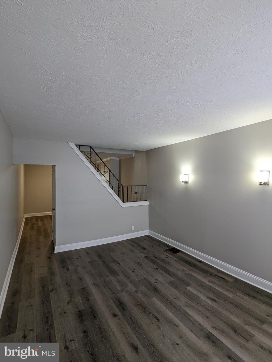 Well renovated  and affordable rowhome! There is a closed in patio in the back yard that can easily be converted into parking.  Come check it out!