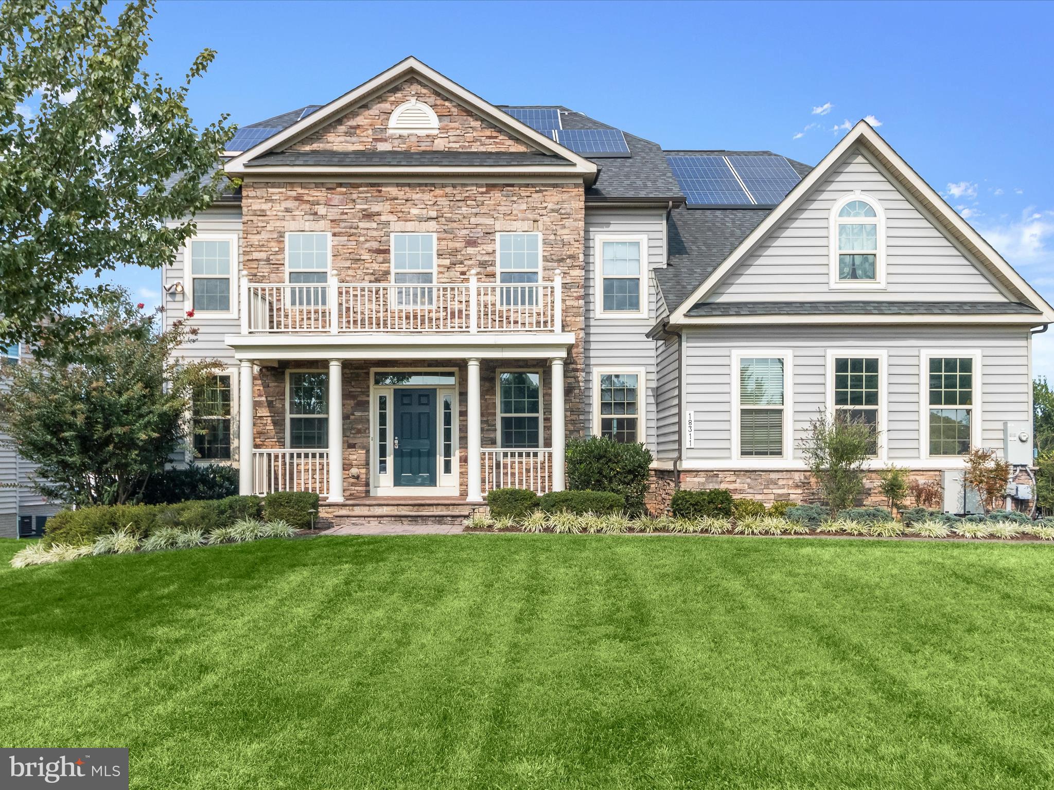 Welcome to 18311 Chelsea Knolls Drive, a spectacular Colonial tucked away in the prestigious Chelsea Knolls community of Mt. Airy. This residence beautifully blends timeless elegance with modern updates. Inside, gleaming hardwood floors, classic moldings, and sun-filled interiors create an inviting atmosphere. A grand two-story foyer, framed by formal living and dining rooms, sets the stage for refined gatherings. At the heart of the home, the chef’s eat-in kitchen features granite countertops, decorative backsplash, an expansive center island with breakfast bar, 42-inch cabinetry, undermount lighting, a double wall oven, and a cooktop. The kitchen flows seamlessly into the breakfast room, where you will find access to the deck with sweeping countryside views. The dramatic two-story family room, anchored by a stacked stone fireplace and coffered ceilings offers the perfect setting for both intimate moments and large gatherings. Additional highlights on the main level include a versatile bedroom or private office with French doors, a powder room, laundry room, mudroom, and direct garage access. Upstairs, the luxurious primary suite impresses with a sitting room complete with wet bar, tray ceilings, a generous walk-in closet, and a spa-inspired en-suite bath with a soaking tub, glass-enclosed shower, and dual vanities. Three additional bedrooms and a full bath complete the upper level. The finished lower level extends the living space with a sprawling game room, wet bar with granite countertops, wine fridge, dishwasher, full bath, and ample storage. Set on nearly an acre, the outdoor oasis features a covered front porch, deck, secure storage, and thoughtfully landscaped grounds designed for both relaxation and entertaining. Additional amenities include solar panels and a built-in speaker system wired for sound. Enjoy outdoor Recreation rolling hills, rural roads, and countryside around Mt. Airy are great for scenic drives, biking and hiking along with Watkin Park, the local Farmers Market, local wineries, breweries, and downtown Mt. Airy. Commuter routes include I-70, MD-27 for quick access to Baltimore, Frederick, and D.C.