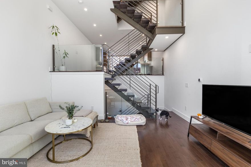 Welcome to 1348 S 19th St! This magnificent 3 bedroom / 2.2 bathroom single family home features garage parking, rooftop deck, in-unit laundry, finished basement, central air, and gorgeous modern finishes. Not to mention about 5 years remaining on the TAX ABATEMENT.  Through the front door, your living room welcomes you home with large windows, hardwood floors, and recessed lighting that follow you throughout the property. Want to avoid the rain or snow? Enter through your private garage with interior acccess. There is a half bath here. Head down to your finished basement, which is perfect for additional storage, den/TV room, home office... whatever you can think of! From the living room, go up the gorgeous stairs to the next floor, which overlooks your living room via a glass balcony. Here, you'll find your lovely dining area and stunning kitchen equipped with bar seating, ample cabinetry, mosaic tile backsplash, and a full lineup of sleek high-end stainless steel appliances. There's a beautiful balcony off the kitchen with a sliding glass door - perfect for enjoying your morning cup of coffee! Continue upstairs where you will find 2 large bedrooms with great sunlight and closet space, plus a full bathroom boasting a floating vanity, medicine cabinet, and fully tiled shower/tub combo. This level also offers in-unit laundry in a hall closet for added convenience. The top level features a wet bar with half bath, plus your stunning primary bedroom. This spacious room was built to impress and can easily fit a king sized bed and offers a walk-in closet and gorgeous full bathroom equipped with a dual sink vanity, a soaking tub, and a separate glass shower.  As you pass the wet bar on this level, you're only a few more steps away from your large rooftop deck with breathtaking city views. Nestled in the residential Point Breeze neighborhood of Philadelphia. Close proximity to Passyunk Avenue for convenient shopping options. You’ll be close to public transportation, Wharton Square and Vare Recreation Center. Walkable to great local spots for drinking and dining like Two Eagles Cafe, On Point Bistro, American Sardine Bar, Pharmacy, Philly Tacos, El Mezcal Cantina, and so many more! Don't miss out on this opportunity to own your own piece of luxury. Schedule a tour today.