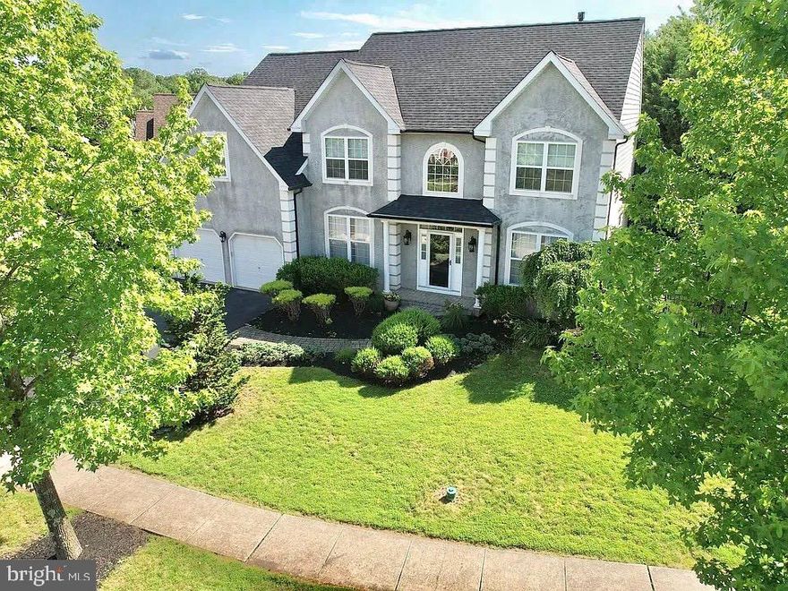 Don't miss this beautiful 4 BR 3.5 bath home with large in law suite in the desirable Long Leaf development in the award winning Pennridge School District.  
Enter into the dramatic 2 story foyer with an open concept floor plan, turn staircase which overlooks the family room below. There is a formal living room, dining room  with wains coating and crown moldings. Large family room with tons of natural light from the two story wall of windows and a cozy gas fireplace for those cold winter nights.  The large kitchen is just off the family room with white cabinets, stainless steel appliances, quartz countertops and subway back splash.  There is a long accented grey center island and large pantry for all your kitchen gadgets.  Also on the first floor is a nice size office with privacy glass double doors, perfect for the work from home person.  
Upstairs has 3 nice size bedrooms, full bath and a massive master suite with a large walk in closet, master bath with soaking tub and separate stall shower.  For added convenience the laundry is located on this floor.    
The massive mainly finished basement with its own outside entrance has the in law suite that contains a large living room space, bar sink, mini frig, cabinets, separate bedroom, full updated bath and walk in closet.  There is also a large storage area where all the utilities are located.  Two sump pumps with battery back up.  
Outside has been professionally landscaped with patio pavers to the front door, brand new roof in 2024 an added 3rd parking space, and two car garage.  The back yard is fenced with a large deck.  The back yard also backs to the woods for extra privacy.