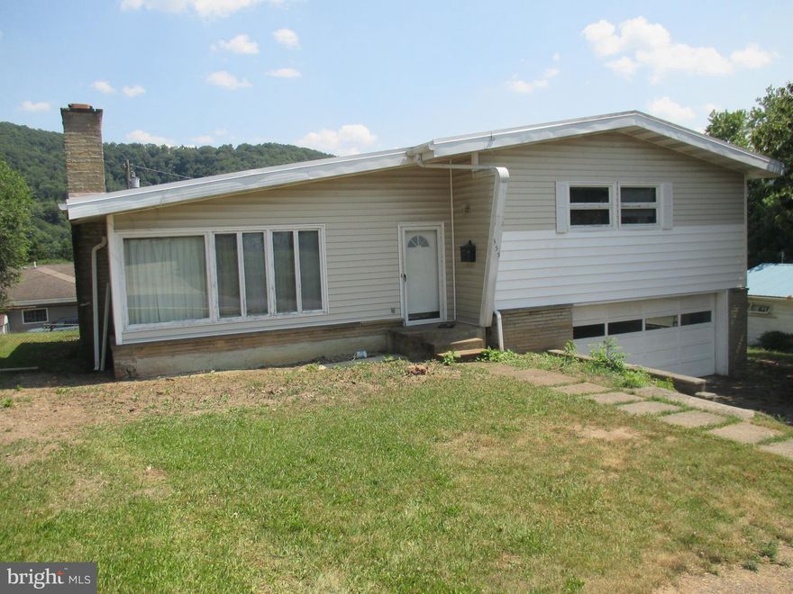 A DIAMOND IN THE ROUGH. WELL LAID OUT 3 BR HOME IN NEED OF AN ARTIST TO RESTORE IT TO IT'S SPLENDOR. HARDWOOD FLOORS THROUGHOUT, LARGE LIVING ROOM, AND CONVENIENT KITCHEN LAYOUT.  OWNERS SUITE FEATURES A HALF BATH AND OVERSIZED CLOSET. 1 CAR GARAGE WITH WALK-OUT DOOR TO THE REAR YARD. LOWER LEVEL FAMILY ROOM HAS A STONE FIREPLACE AND FULL BATH.  THE REAR PATIO OVERLOOKS THE SPACIOUS FENCED REAR  YARD WITH SHED. THIS HOME NEEDS SOME REMODELING BUT COULD BE BEAUTIFUL AFTER. SUBJECT BEING SOLD IN AS-IS CONDITION.